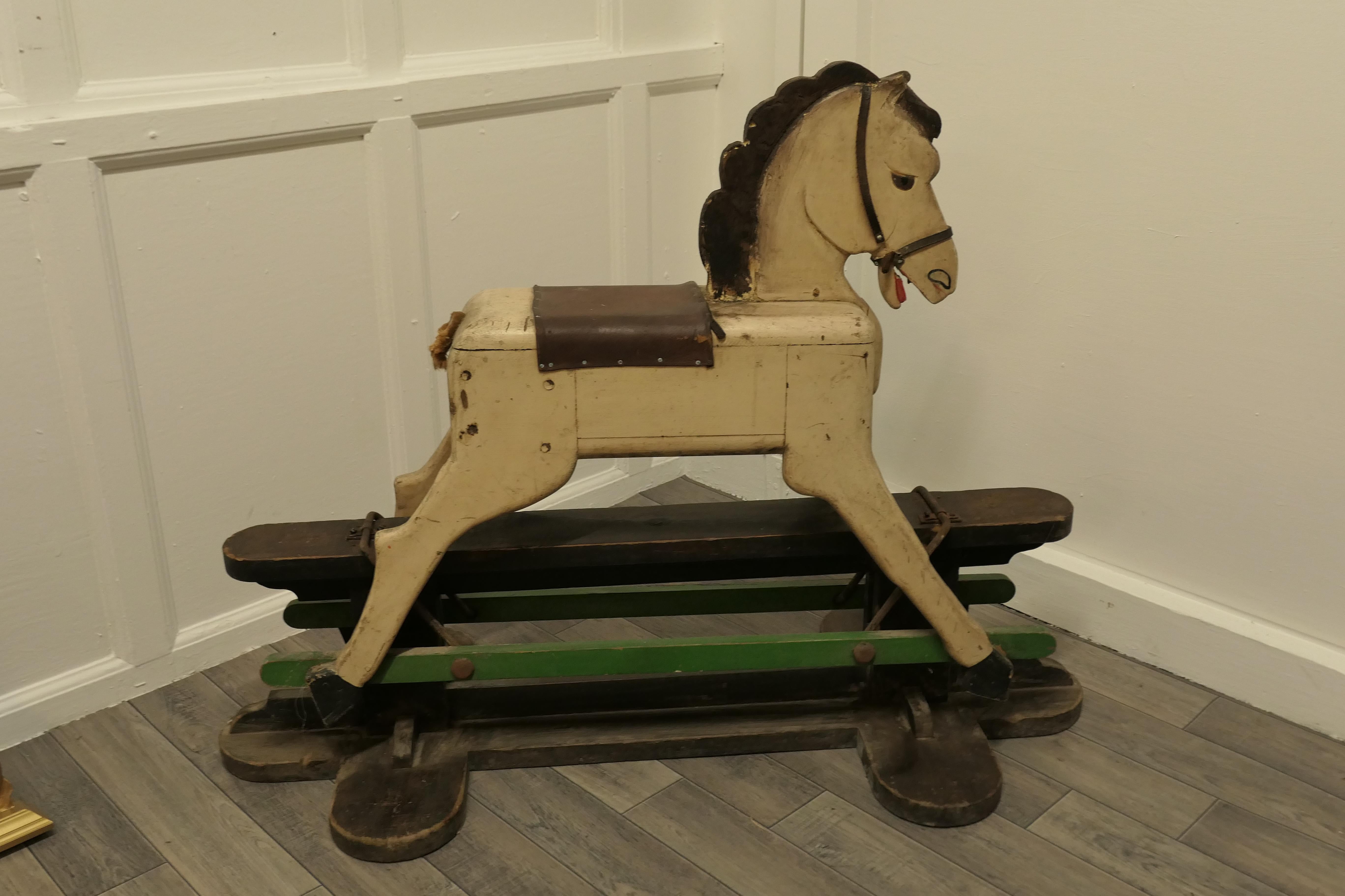 A 1920s wooden rocking horse

Made in solid wood, his paint is getting a bit worn now, our galloper has had plenty of use over his life time as you can see by the lack of hair on his tail but he works and he is ready to go back to work as soon as