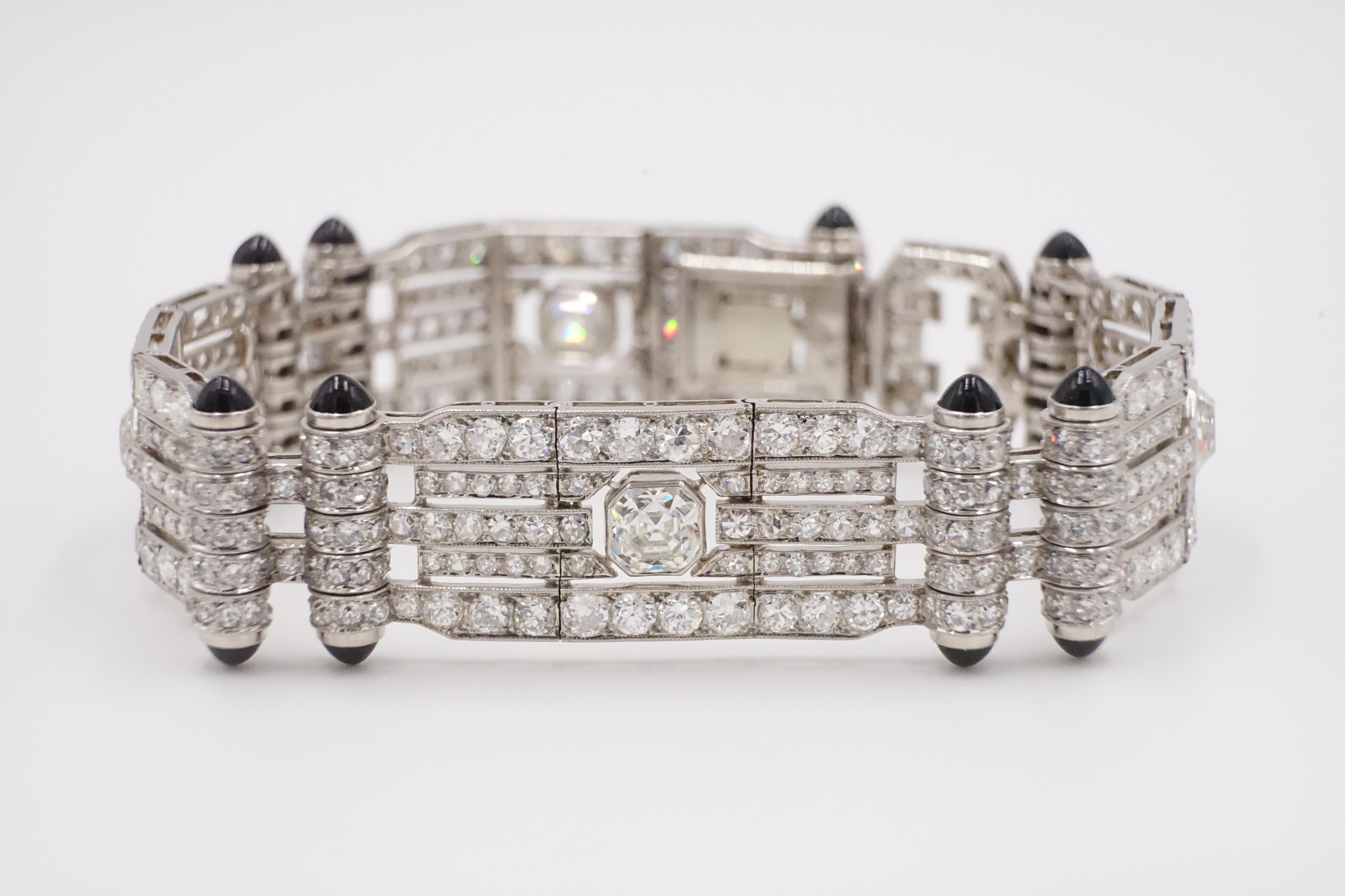 A breathtaking diamond, platinum and black onyx bracelet with the extension attached it can be wore as chocker.

The the contrast between black onyx at corners of each section and platinum brings out the brightness and the colour of the diamonds and