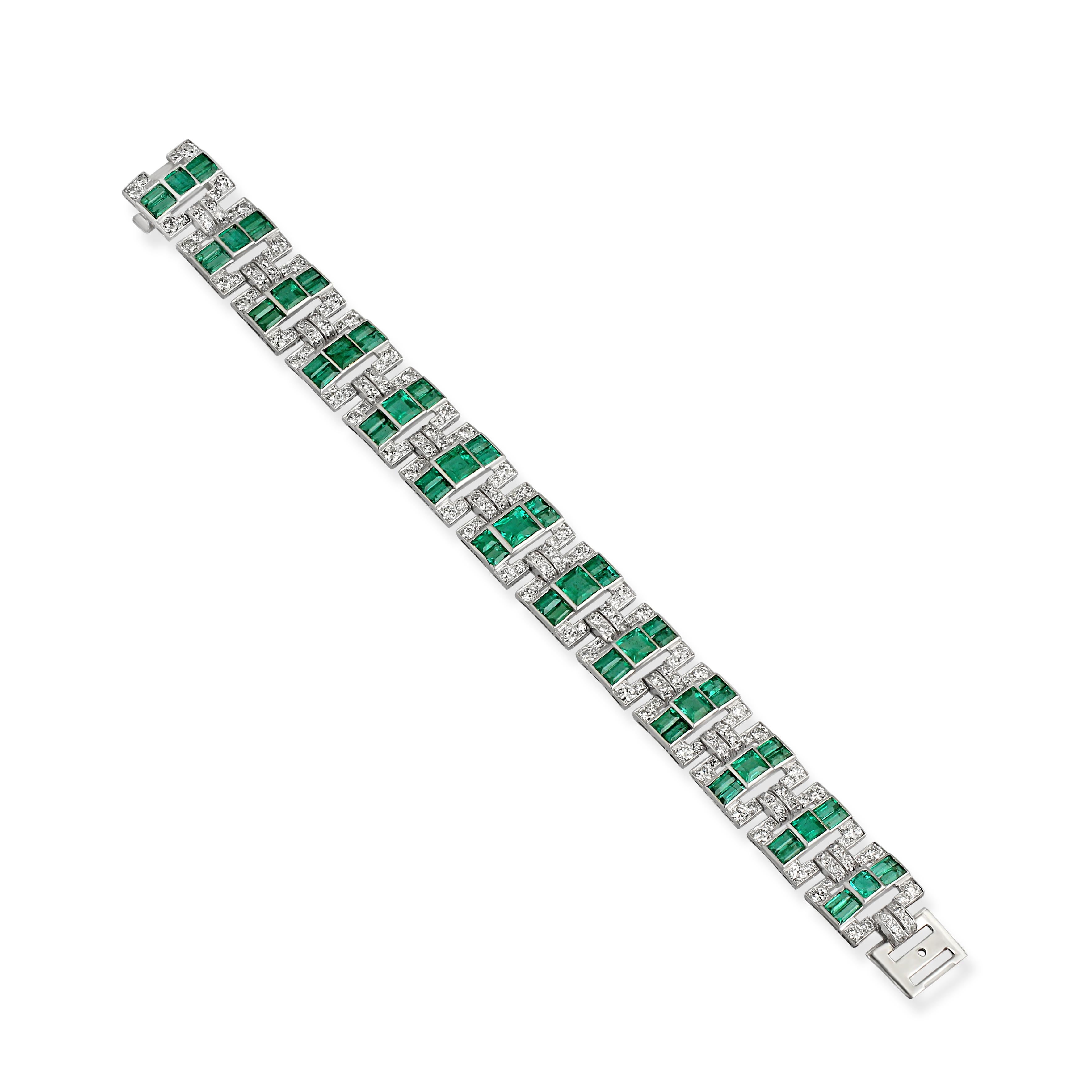 An emerald and diamond line bracelet set with step-cut emeralds and circular and single-cut diamonds mounted in platinum. This piece was crafted during the 1930s and comes with a fitted case stamped Garrard & Co brand. Length = 18.5 cm.