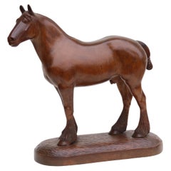 A 1930s English hand carved study of a Belgian draught horse stallion.