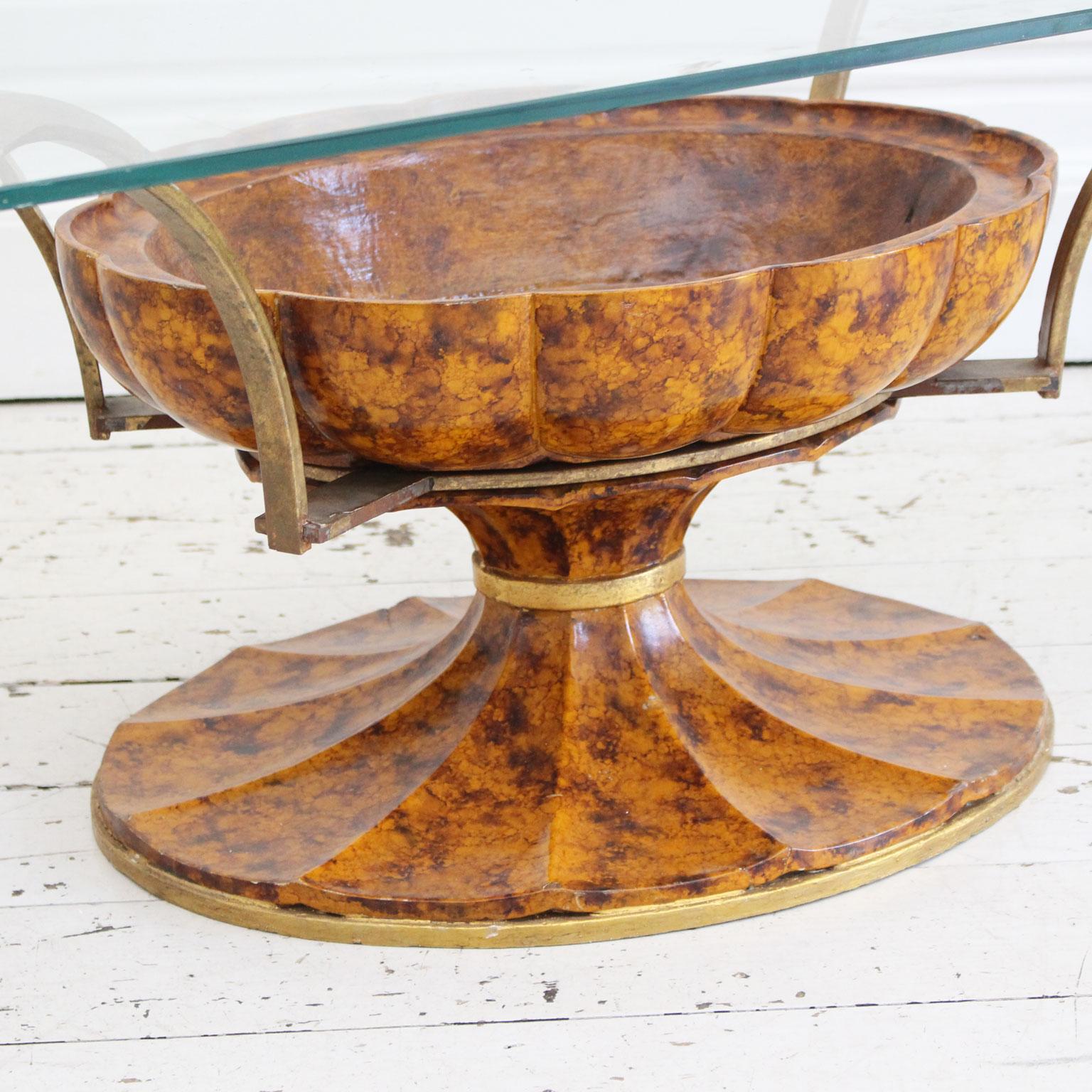 This unusual coffee table was once housed in the Gucci head office in Milan and you can see why. The wonderful urn shape is decorated with hand painted faux tortoiseshell. This has gilded metal bands and arms which splay out to support the glass