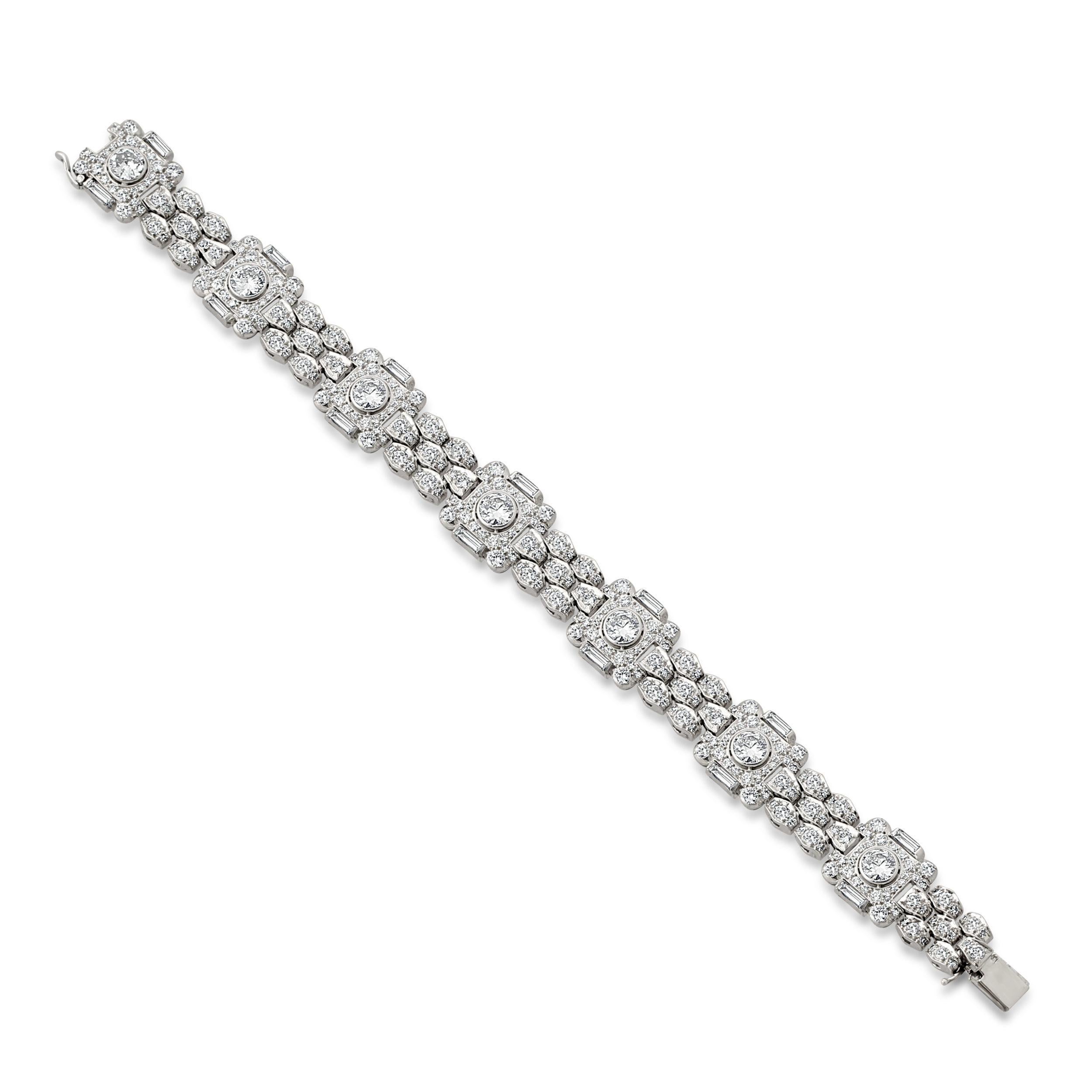 A beautiful 1930s platinum and diamond bracelet. Set with approximately 15 carats of diamonds in flexible links.  Length = 18cm, Width = 1.5cm