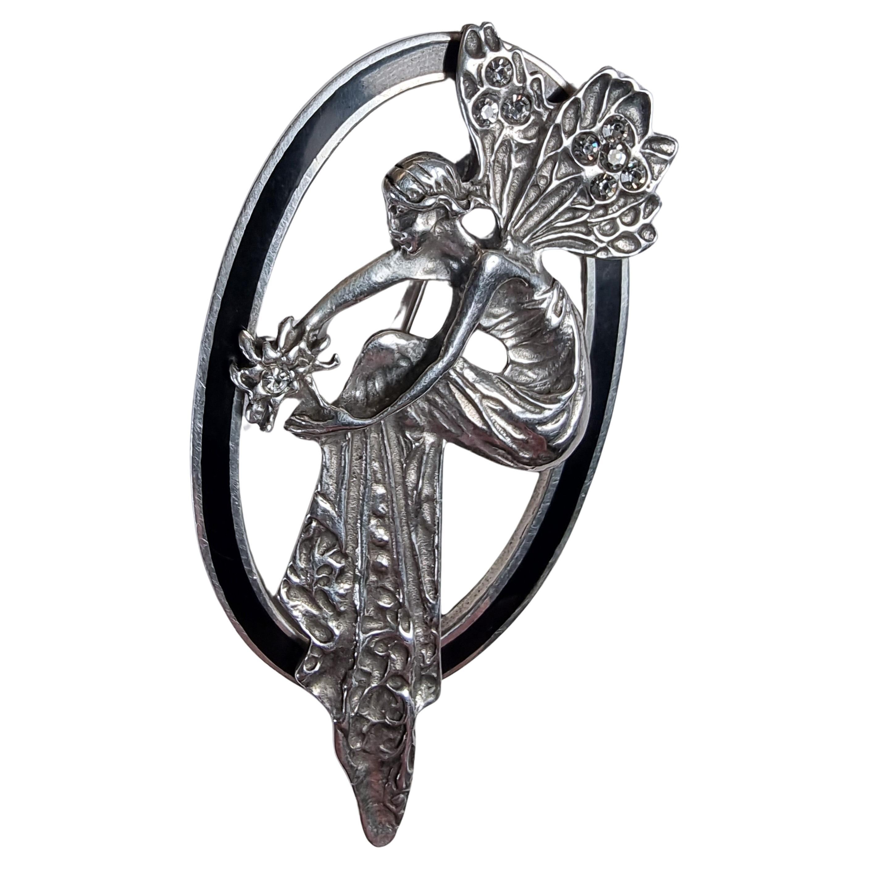 A 1930s silver and black enamel fairy brooch For Sale