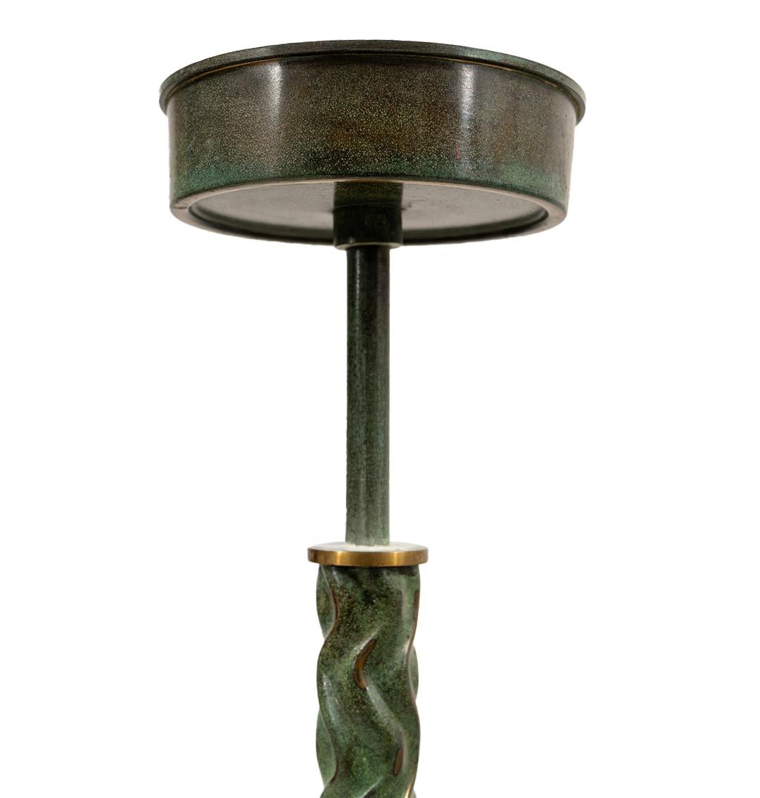 A 1930s Swedish Art Deco pendant with a raw glass edge. The glass with subtle frosted palm motif and a stem with a verdigris artisan finish. Price includes new UL wiring for 3 medium sockets