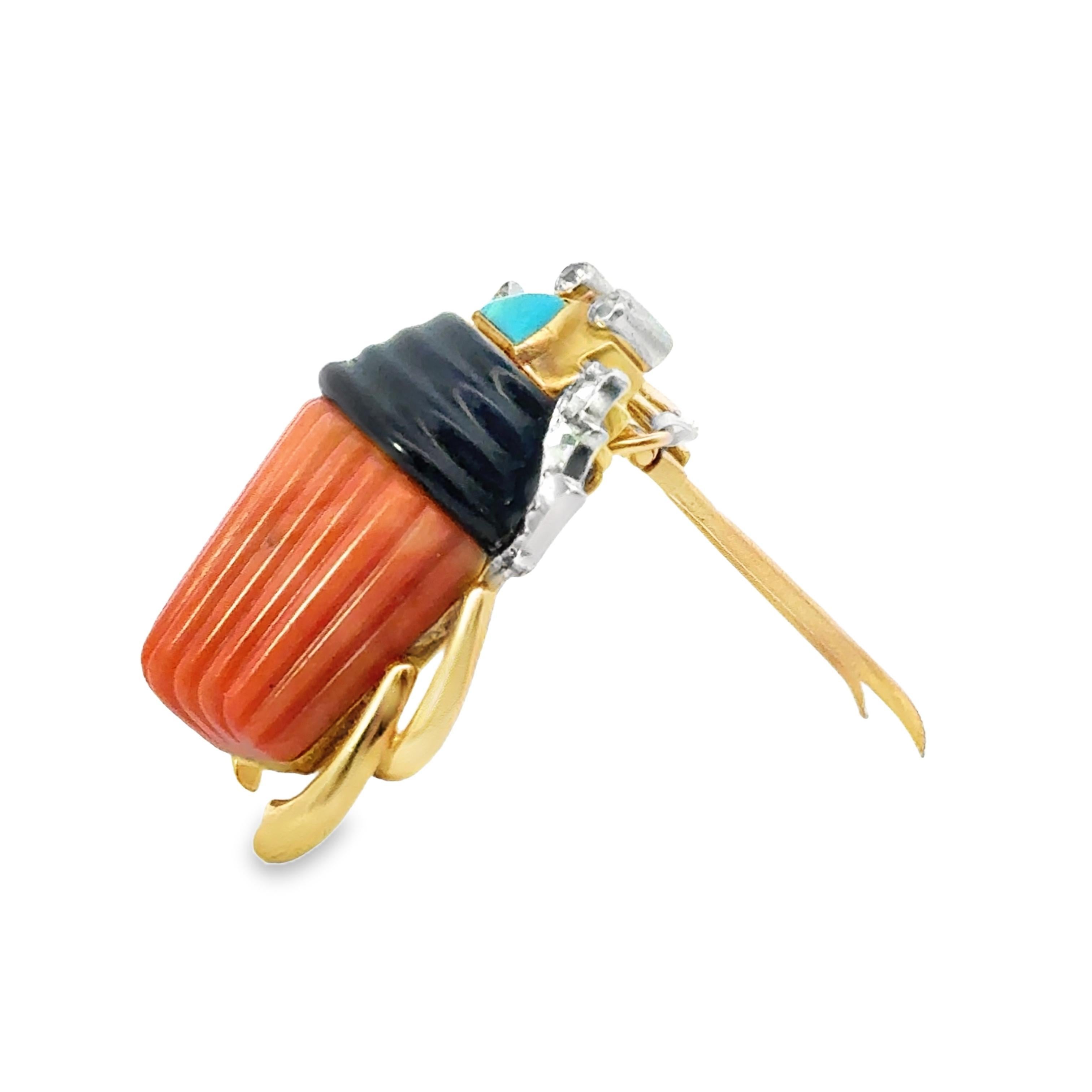 This striking scarab brooch features a captivating design, adorned with red coral and blue turquoise. The vibrant stones create a bold contrast, enhancing the brooch's distinctive form.

Crafted in gold, yellow gold, enamel, and platinum, the piece