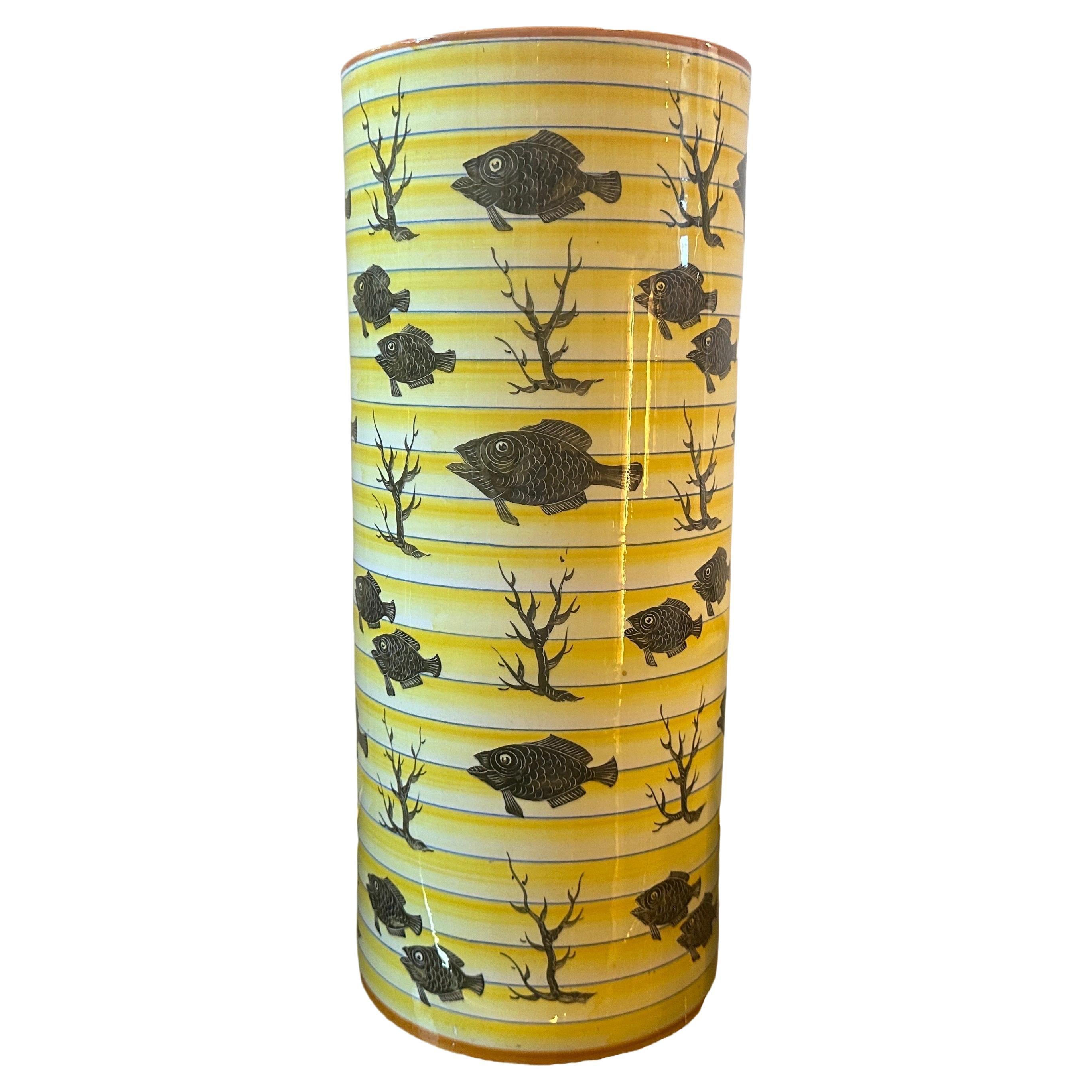 A rare art deco vase also usable for umbrella stand hand-crafted in Sesto fiorentino by A.C.I. it's in good conditions overall and marked on the bottom. The yellow base itìs decorated with black fishes and corals. It's an amazing collector piece