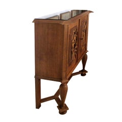 A 1940’s E. Hallanvaara oak cabinet with carvings on the doors, Finnish