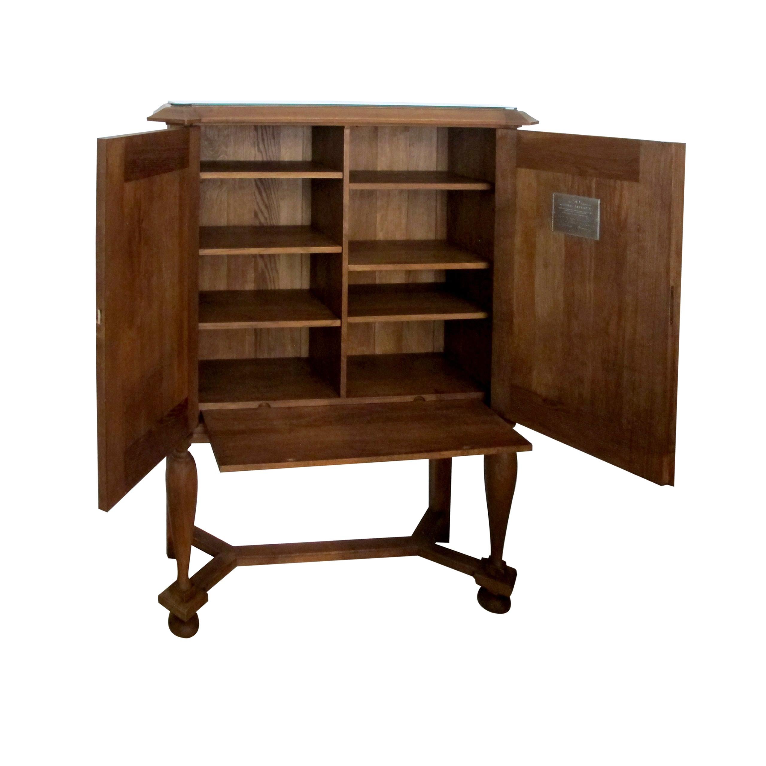 Mid-Century Modern A 1940’s E. Hallanvaara oak cabinet with carvings on the doors, Finnish  For Sale