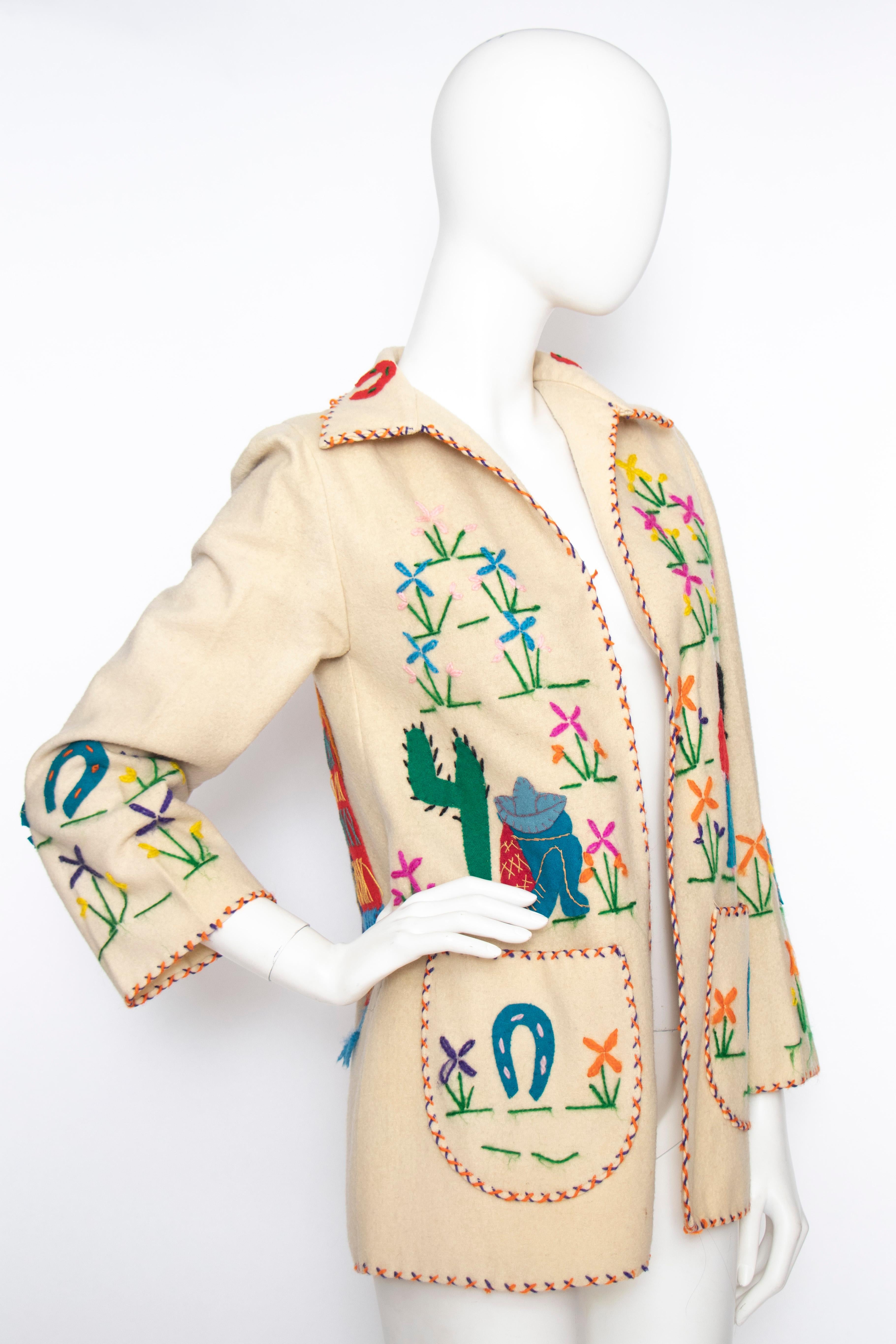 A 1940s vintage open-front jacket with rounded patch pockets and an absolutely incredible embroidered motif in bright colours. 
The jacket us unlined.  