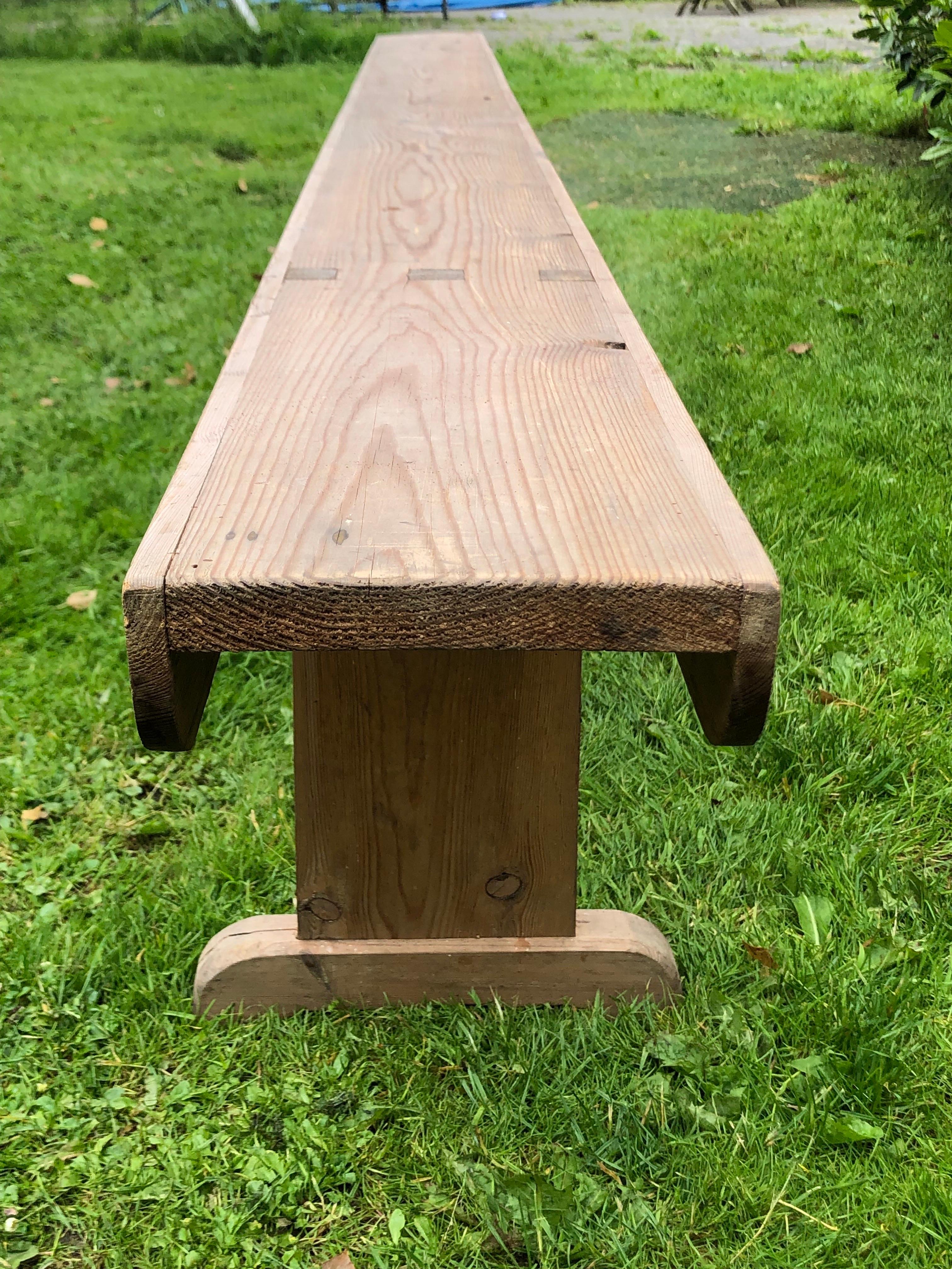 A 1940ties long low pine bench 281 cm long. 