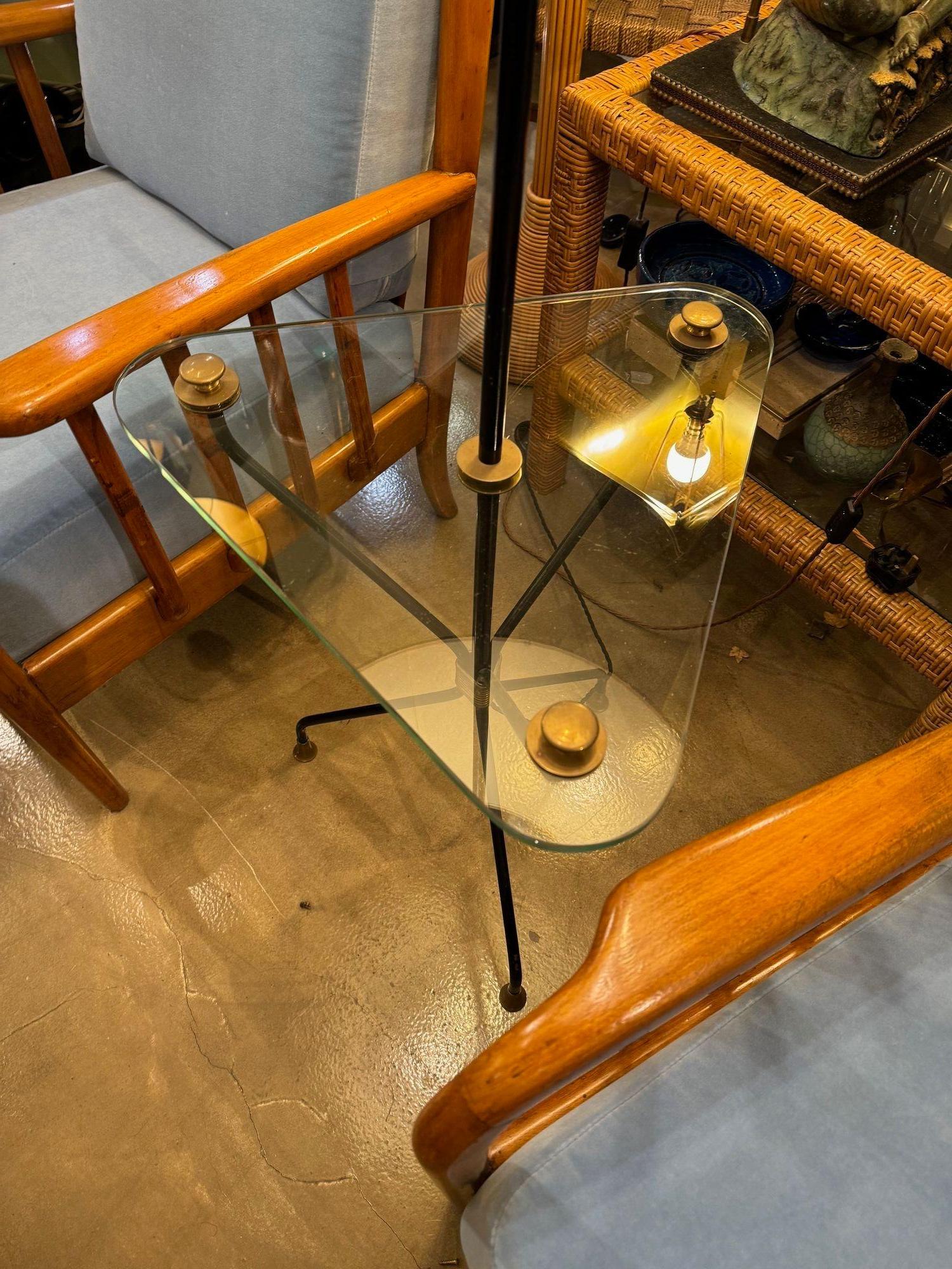 A 1950s French black lacquer and brass tripod floor lamp with glass table For Sale 9