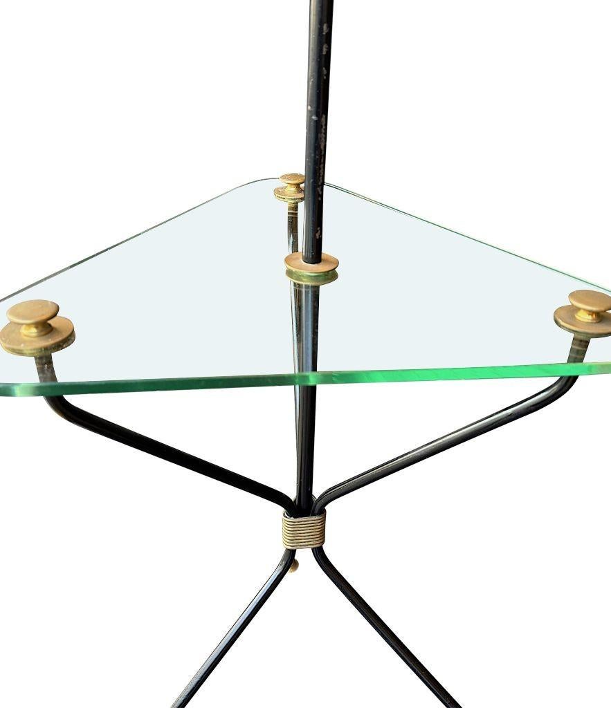 A 1950s French black lacquer and brass tripod floor lamp with glass table For Sale 11