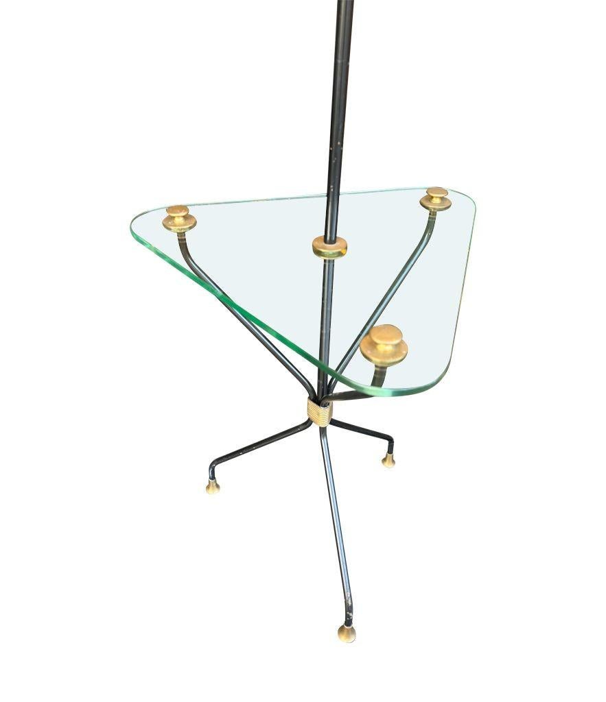 A 1950s French black lacquer and brass tripod floor lamp with glass table In Good Condition For Sale In London, GB