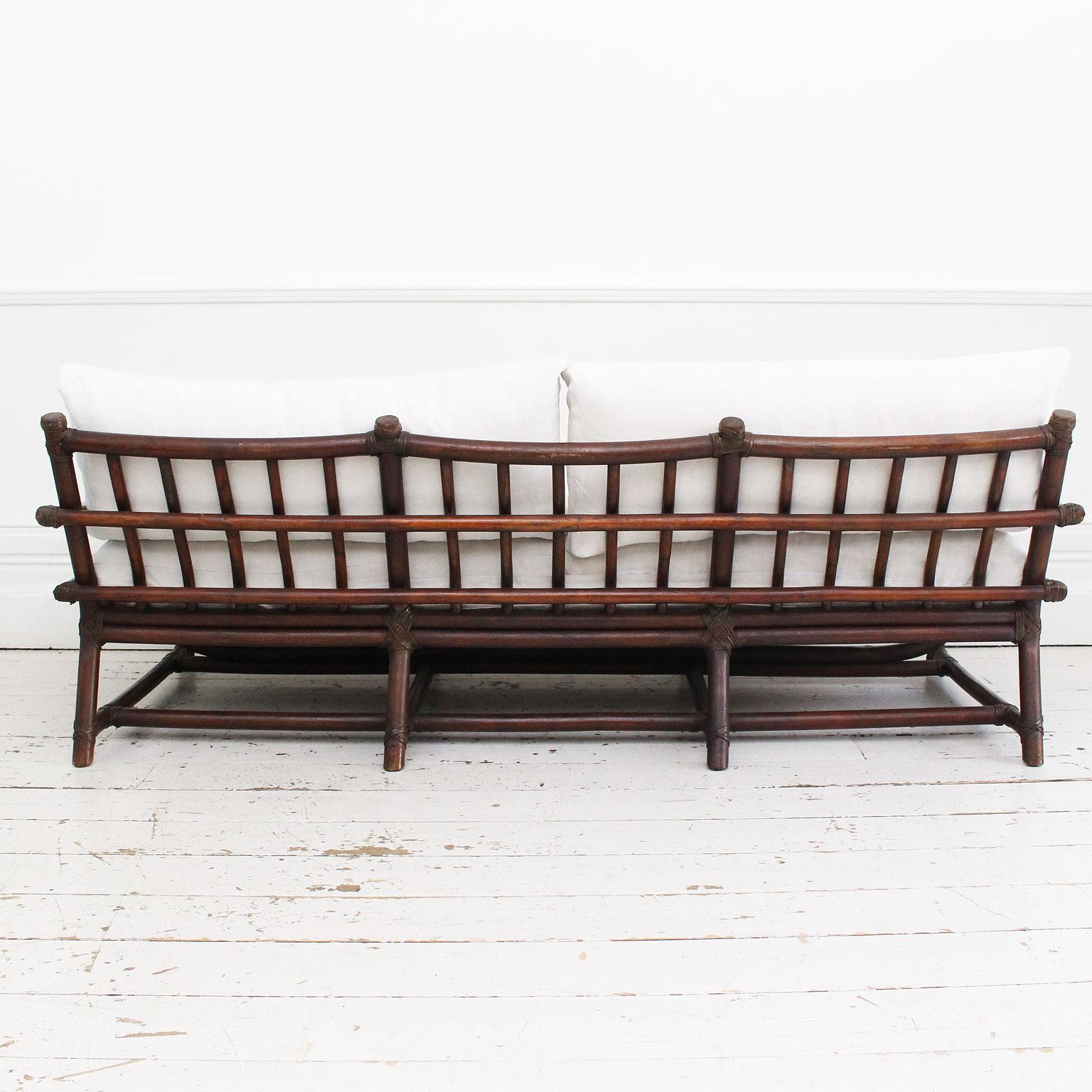 Mid-20th Century A 1950's French Dark Bamboo Sofa with Antique Linen Cushions