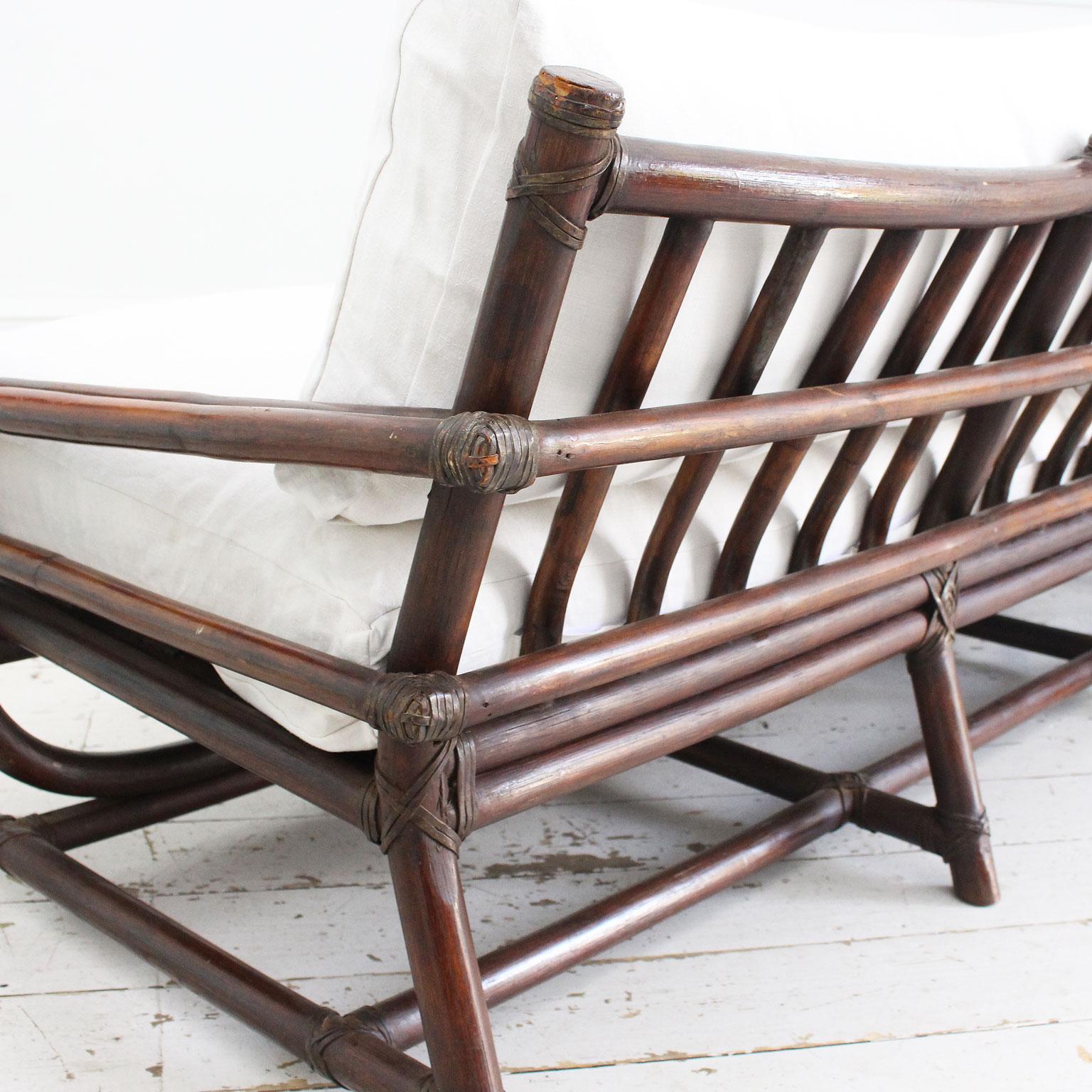 A 1950's French Dark Bamboo Sofa with Antique Linen Cushions 3