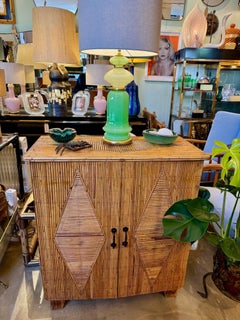 A 1950s French Riviera split cane bamboo cabinet by Audoux and Minet