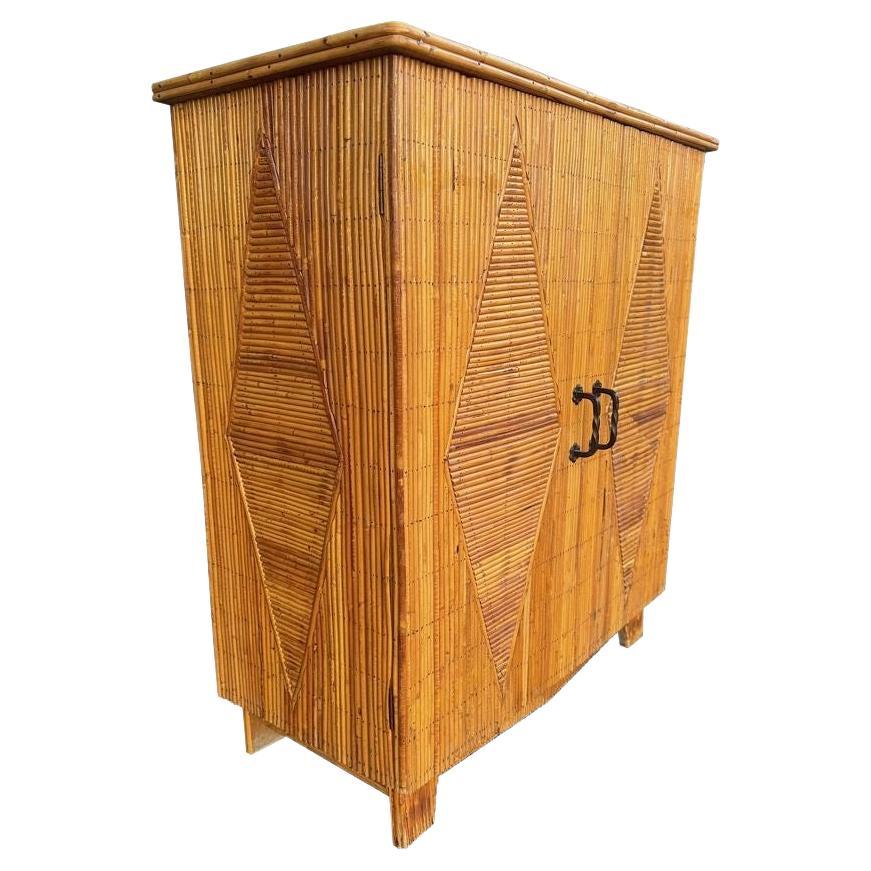 A 1950s French Riviera split cane bamboo cabinet by Audoux and Minet
