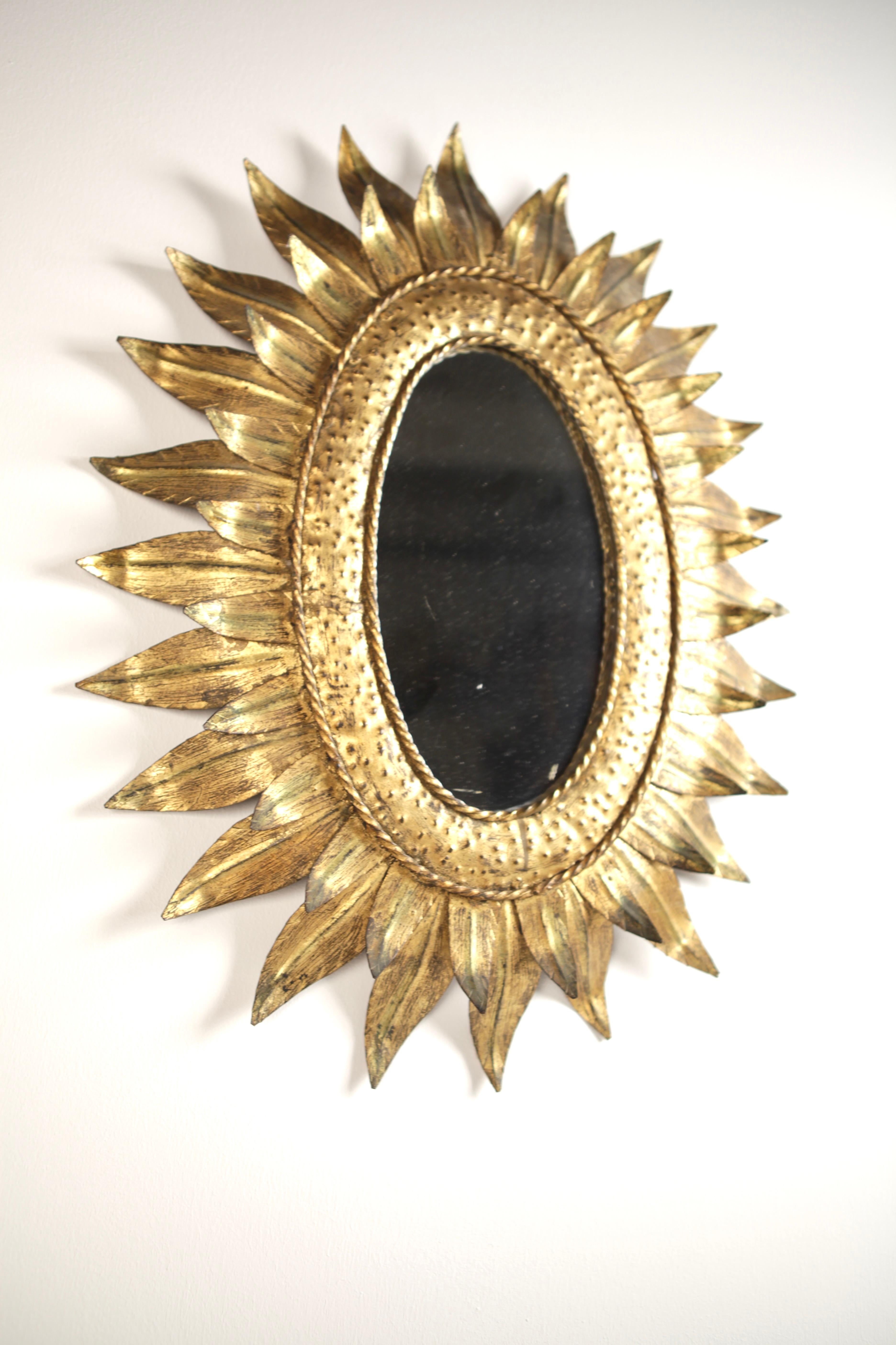 Spanish A 1950s Gilded Metal Sunburst Mirror.