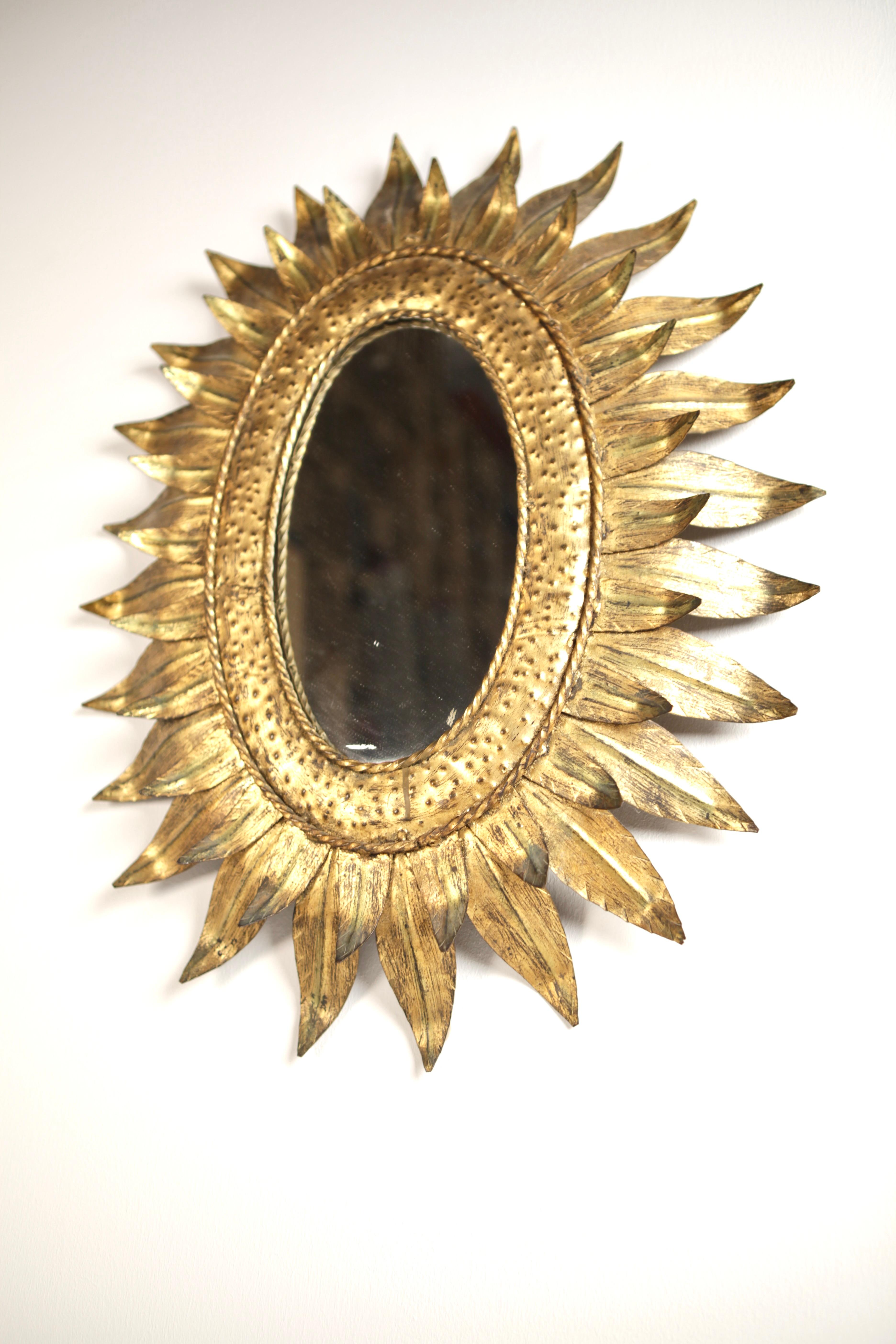 Gilt A 1950s Gilded Metal Sunburst Mirror.
