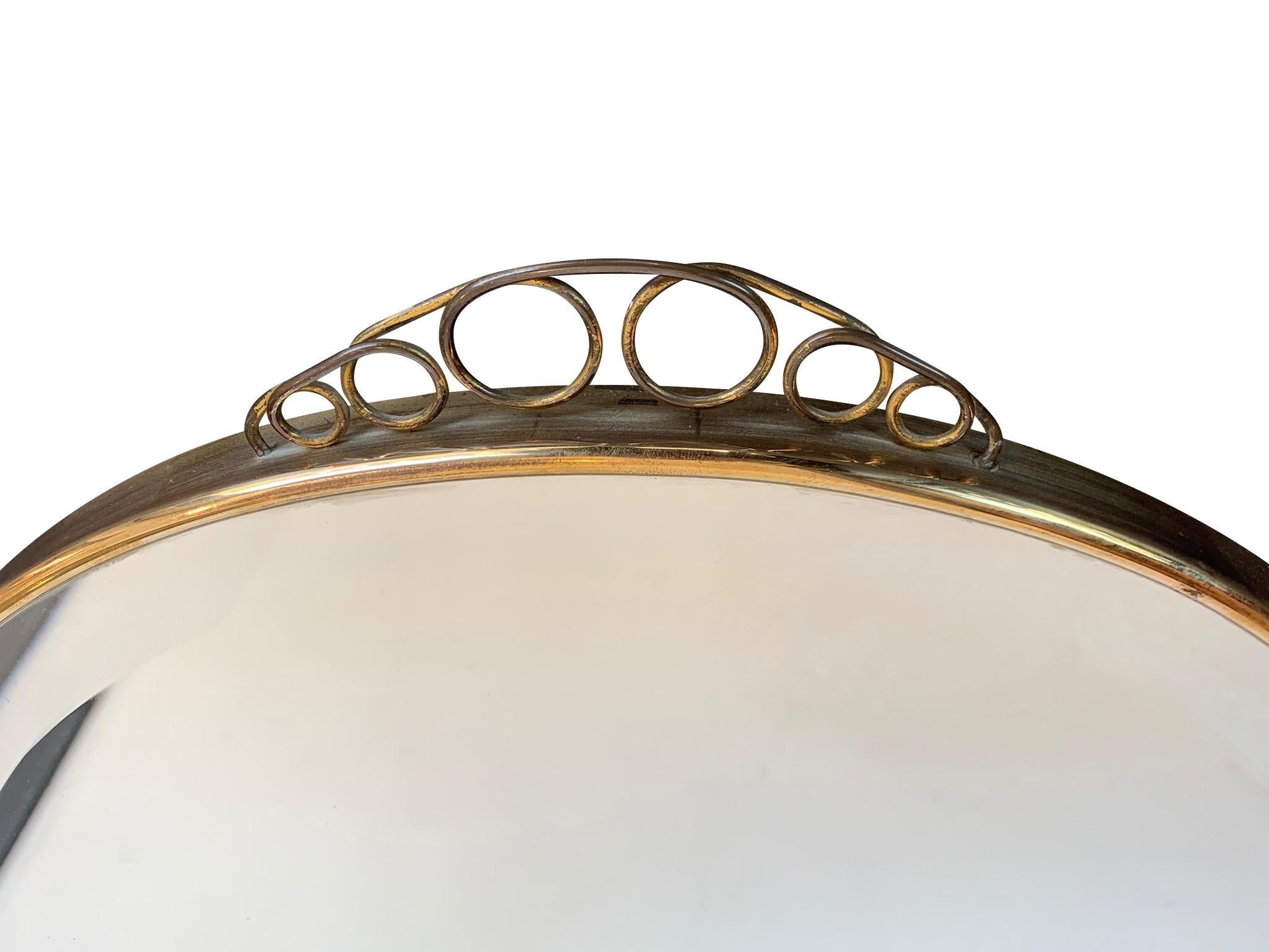 1950s Italian Circular Mirror with Bevelled Glass, Brass Frame and Top Detail In Good Condition In London, GB