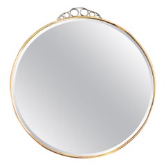 Miroir circulaire italien des années 1950 avec verre biseauté, cadre en laiton et détails supérieurs