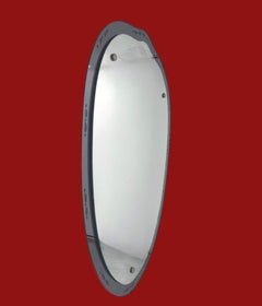 A 1950s Italian shield shaped mirror with black mirrored, etched frame