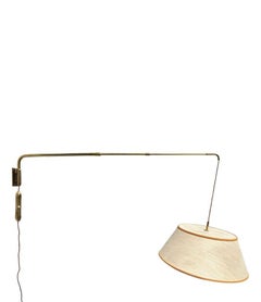 A 1950s Italian telescopic solid brass wall light with counter weight switch