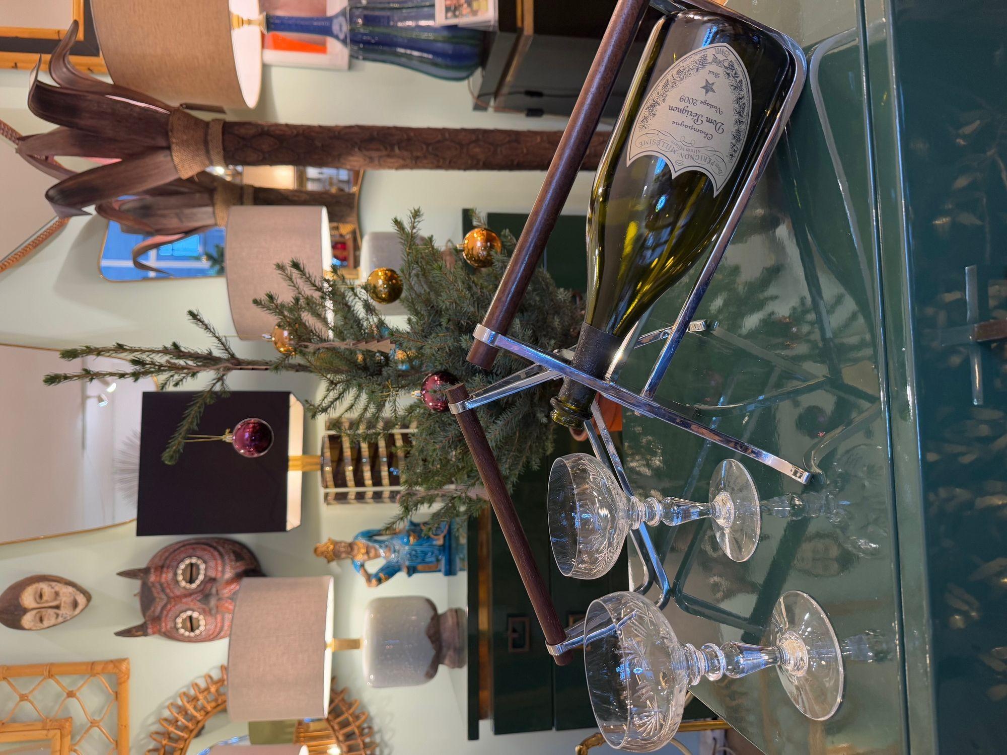 A 1950s Jaques Adnet chrome and walnut bottle holder for Christolfe.