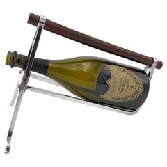 A 1950s Jaques Adnet chrome and walnut bottle holder for Christolfe