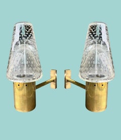 A 1950s Murano glass and brass wall light by Gino Sarfatti and Archimede Seguso.