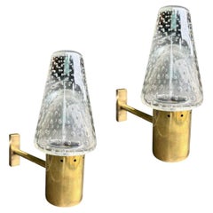 A 1950s Murano glass and brass wall light by Gino Sarfatti and Archimede Seguso.