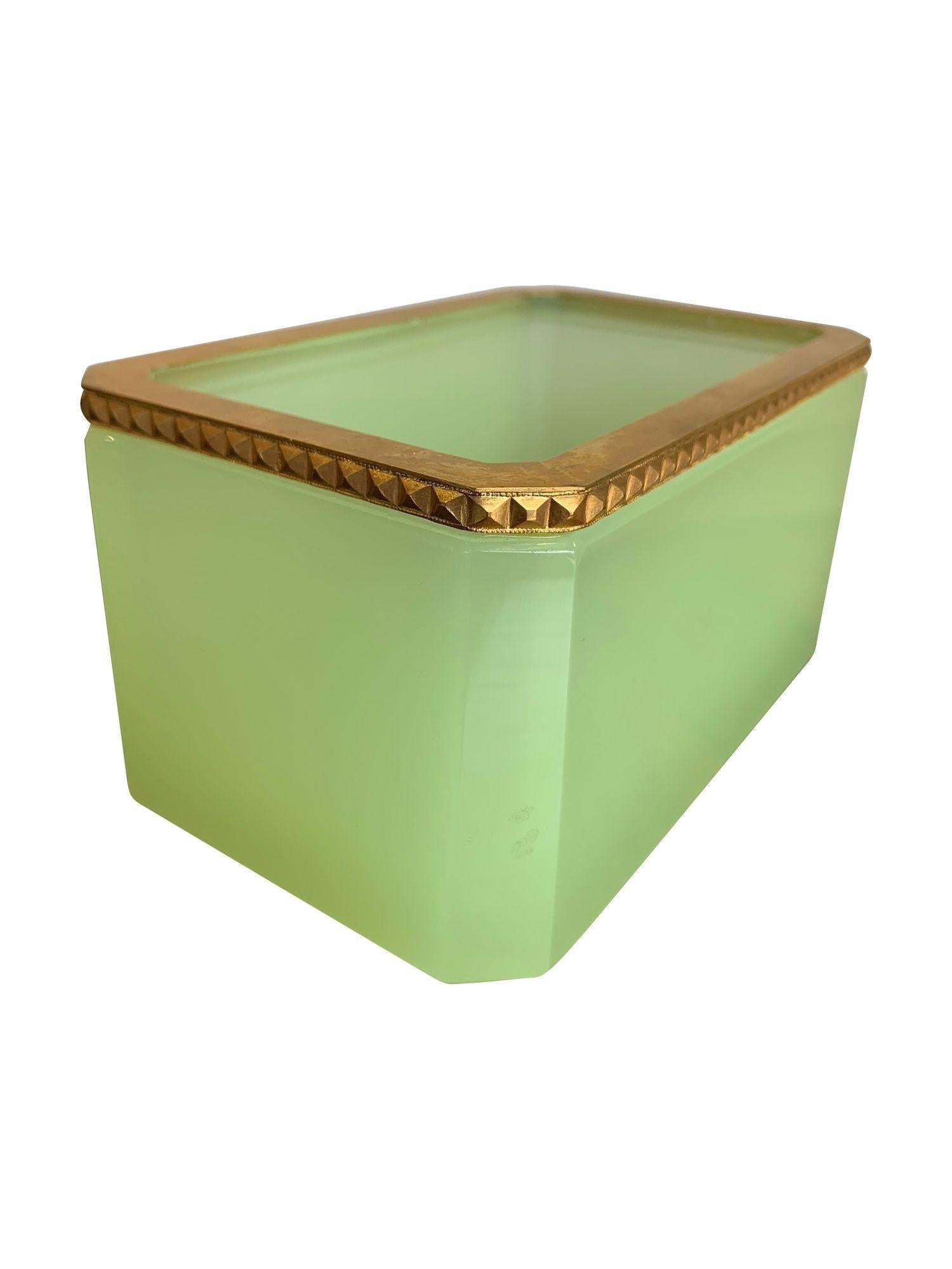 A 1950s Murano green opaline jewellery box by Cendese with gilt metal edging. 
There are other available colours and designs under other listings.