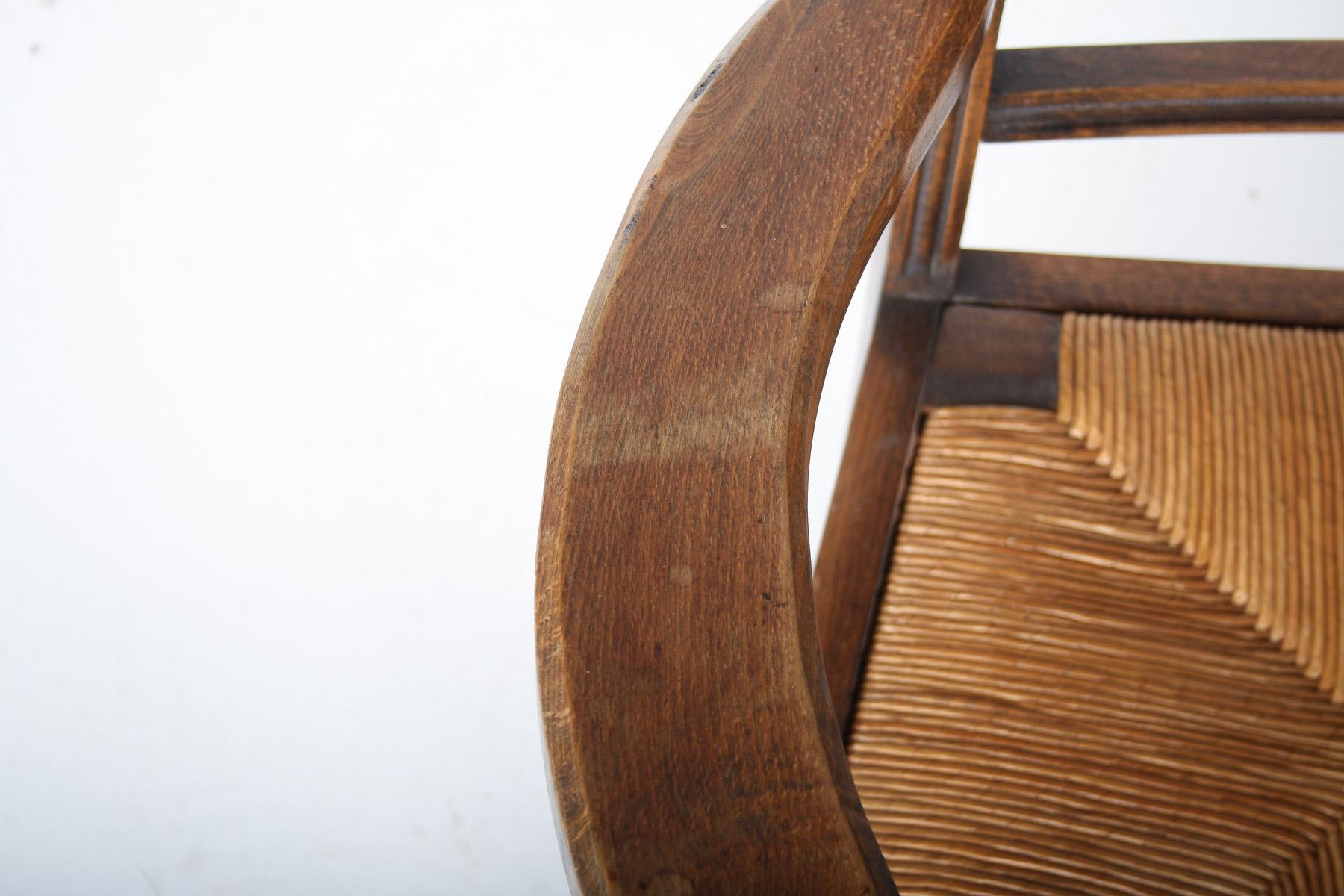 Fauteuil tire-bouchon en Oak des années 1950 avec assise en paille attribué à Charles Dudouyt en vente 13