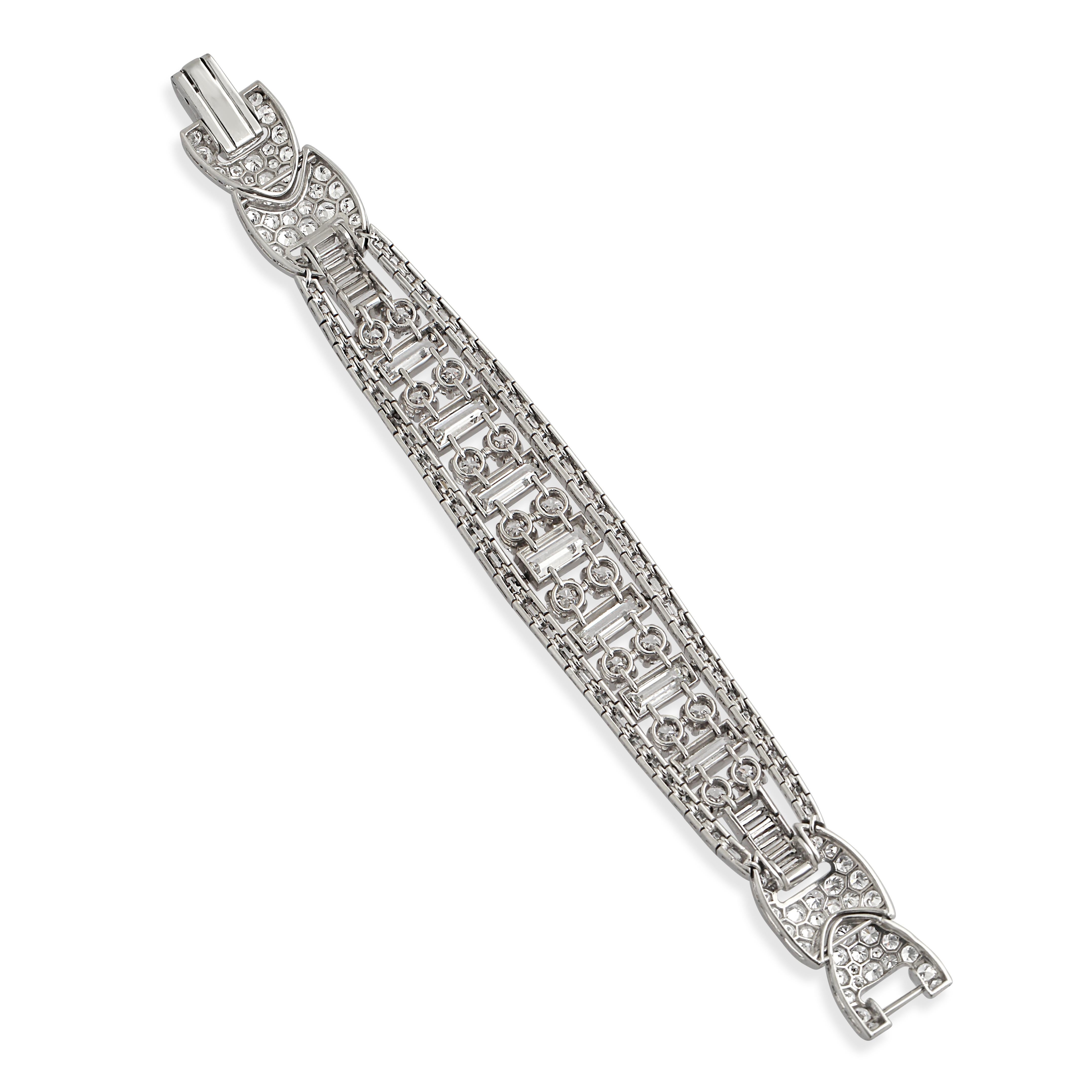 A 1950s platinum and diamond bracelet. Elegant and wonderfully articulated this mid century bracelet is set with approximately 8.00 carats of round-cut diamonds surrounded by additional baguette-cut and pavé-set diamonds.

Price available on request.