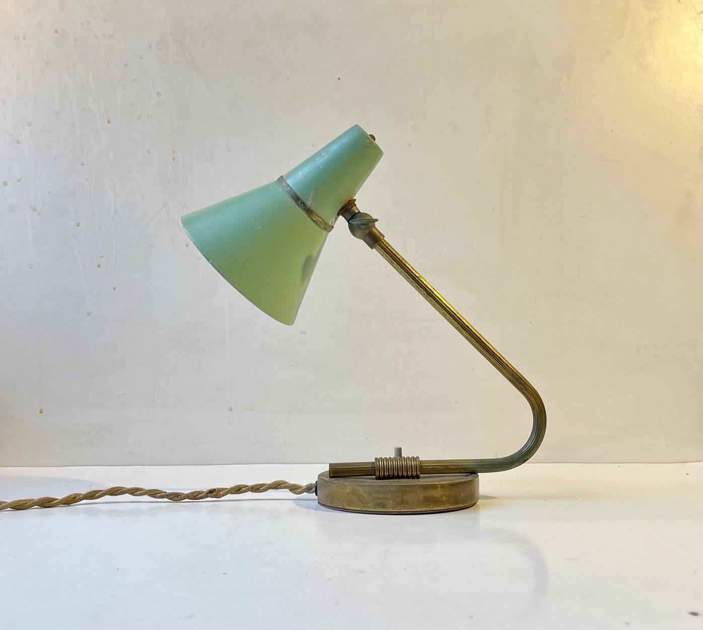 Adjustable Wall lamp made from brass and aluminium. It features a pastel green shade with brass band. It was made in Scandinavia during the 1950s, probably by ASEA or Falkenberg. Working order. Measurements: Height/dept: 25 cm, Diameter: 11 cm