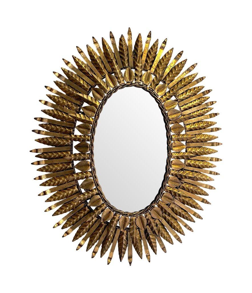 Gilt 1950s Spanish Oval Wrought Iron Back Lit Sunburst Mirror For Sale