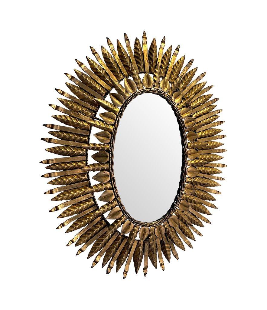 1950s Spanish Oval Wrought Iron Back Lit Sunburst Mirror In Good Condition For Sale In London, GB