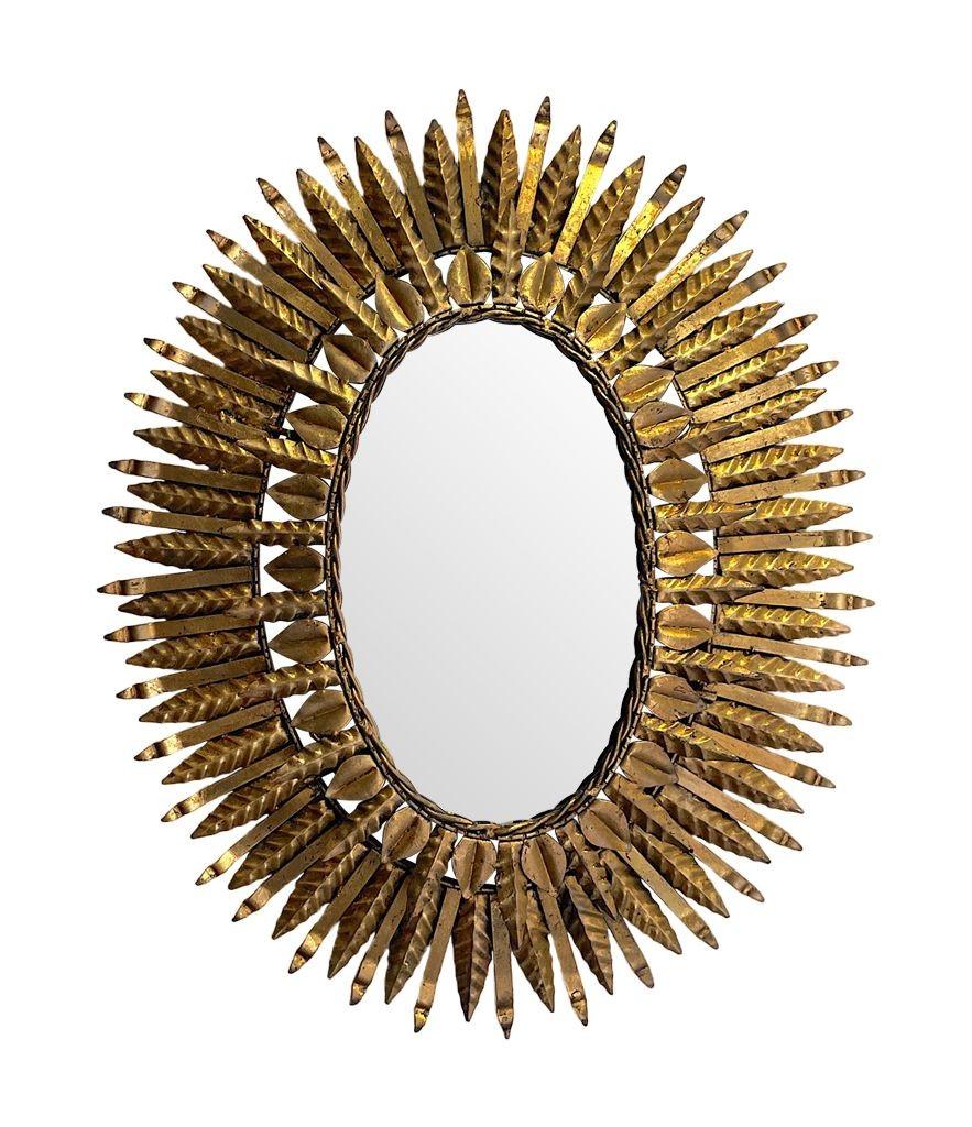 Mid-20th Century 1950s Spanish Oval Wrought Iron Back Lit Sunburst Mirror For Sale