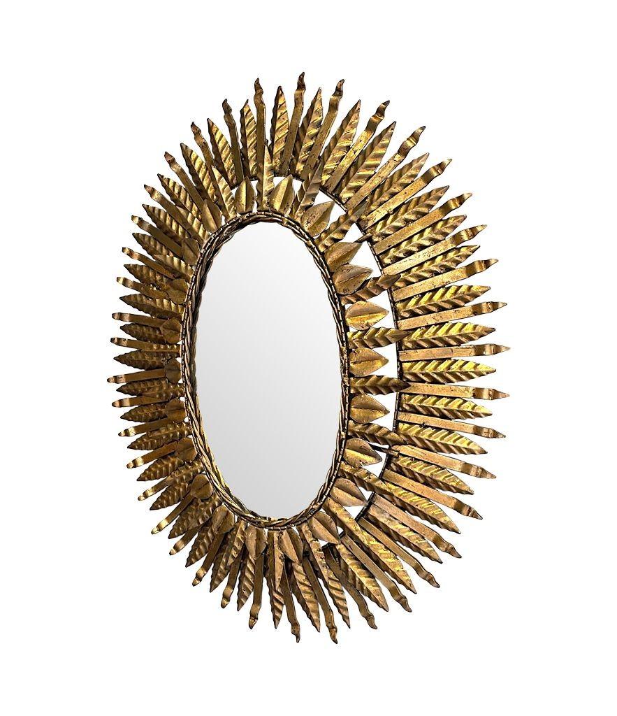 1950s Spanish Oval Wrought Iron Back Lit Sunburst Mirror For Sale 1
