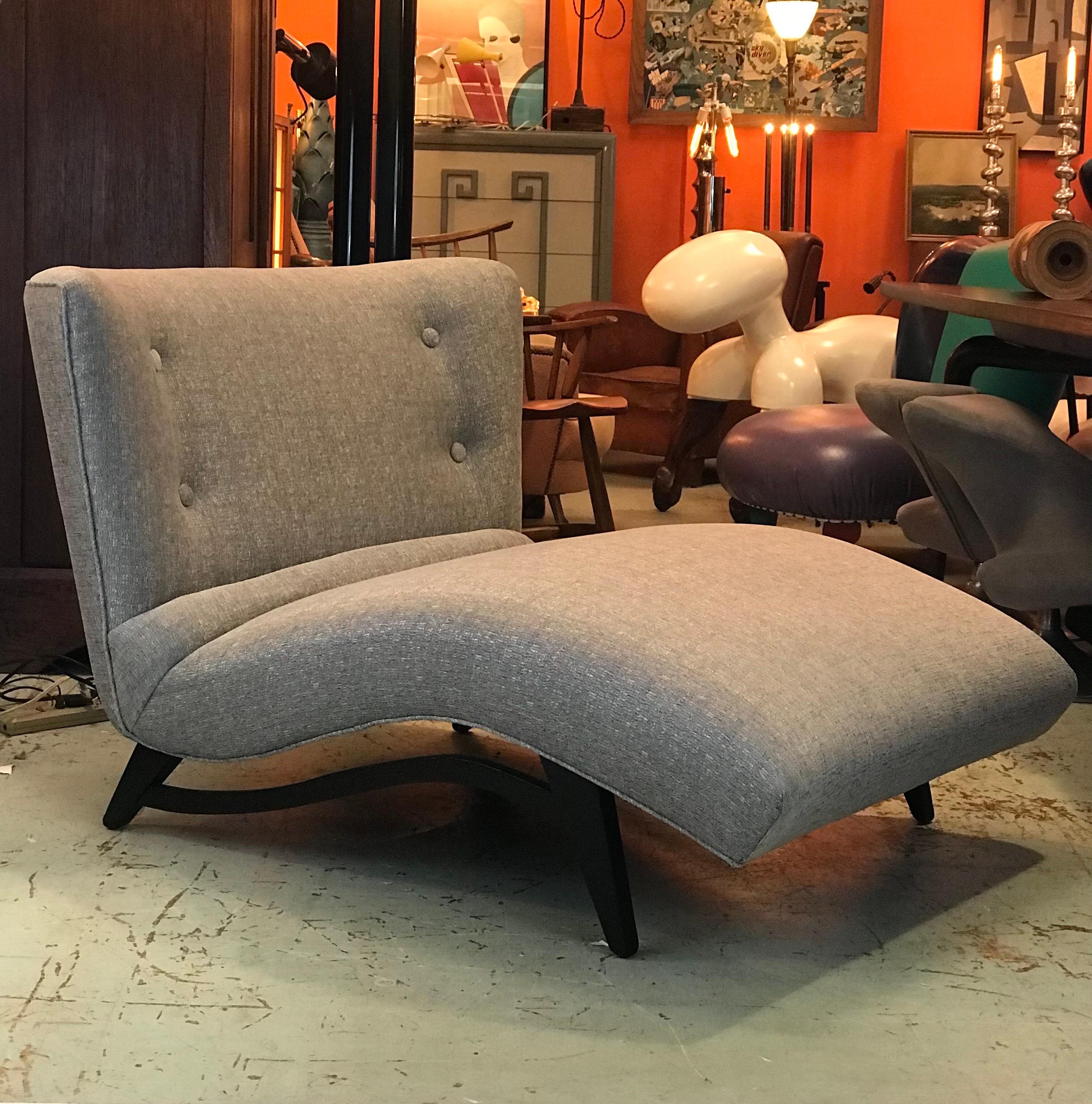 A 1950’s wave form chaise lounge by Lawrence Peabody for Selig with the tell tale built in rolled lumbar pillow that sets this chair apart from others in its style. 
 Set on four tapered sturdy built in black legs with a decorative stretcher that