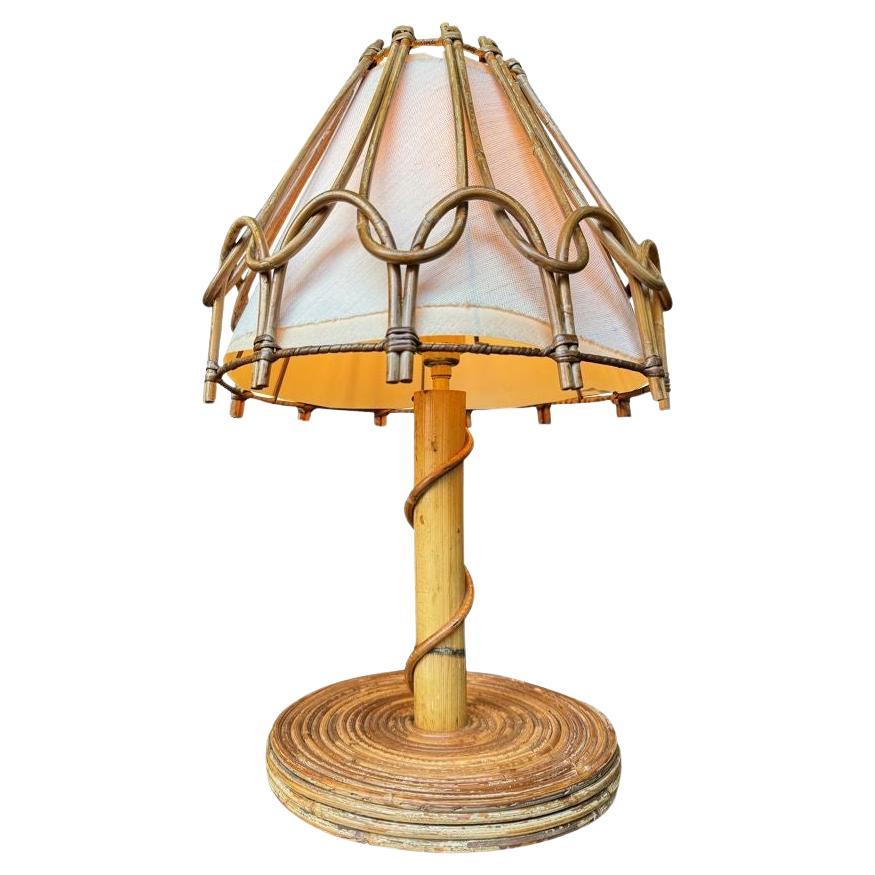 A 1960s bamboo lamp by Louis Sognot with orignal bamboo and linen shade