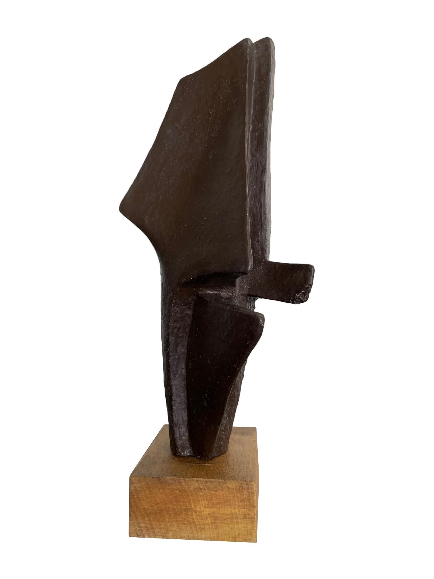 A 1960s Belgian ceramic abstract sculpture with bronze textured style finish mounted on natural wooden base, signed on the base 