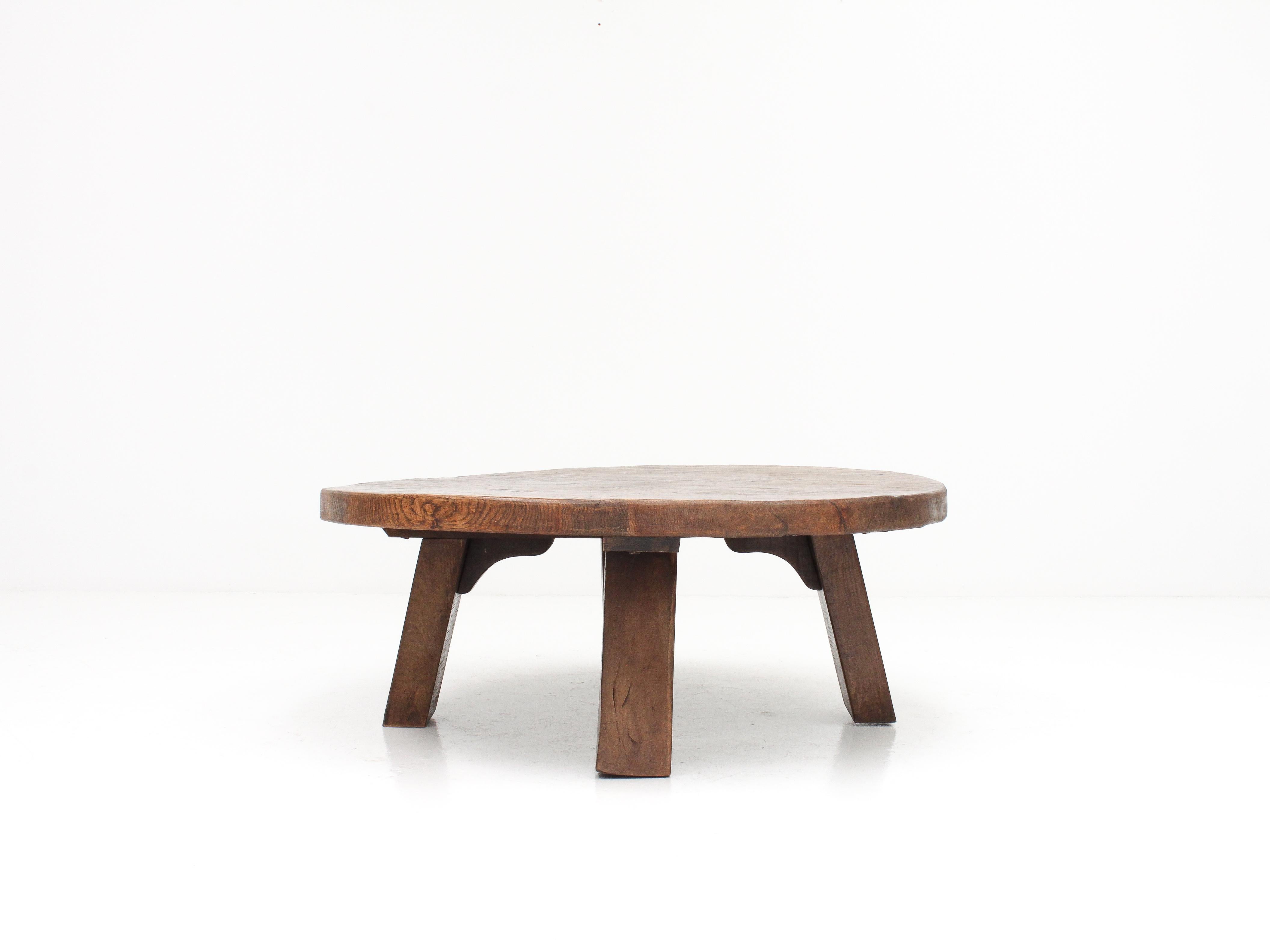 A heavy, solid oak French coffee table dating from the 1960s/70s.

With a brutalist, rustic and primitive aesthetic the table has a strong presence.

The condition is good with only slight imperfections and markings.

We offer fast,