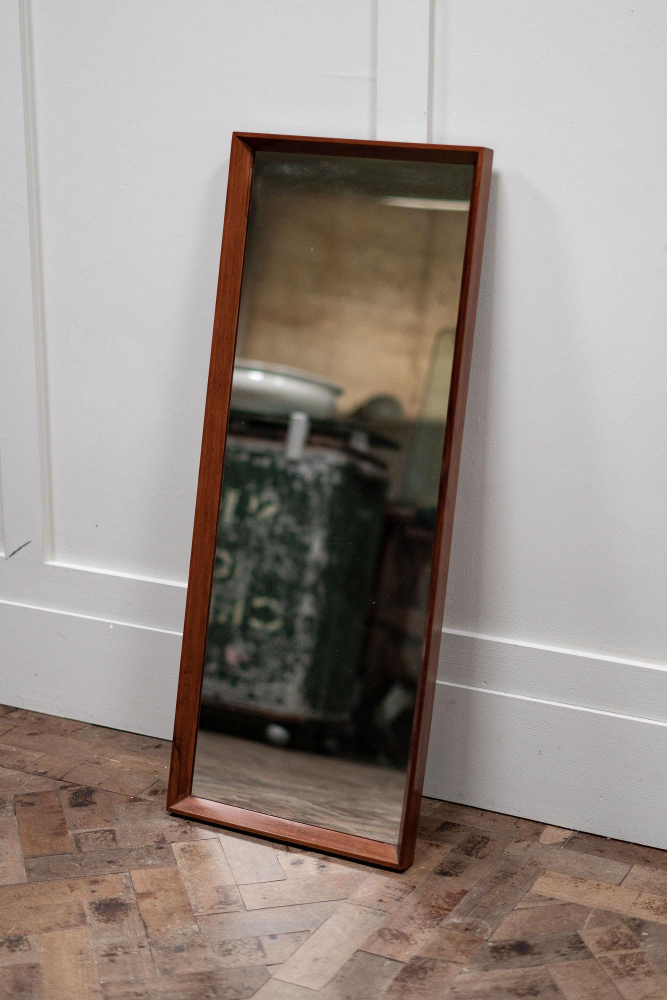 A 1960s Danish rosewood mirror.

Measures: Height 90cm
Width 38cm
Depth 3.5cm.