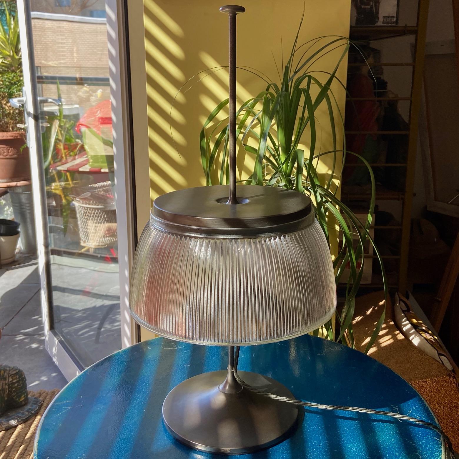 A smart 1960's desk or table lamp, silver grey colour metal and moulded glass, attributed to Tito Agnoli for O-Luce. Some wear and tear. Good working order. 