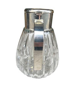 A 1960s German crystal and silver plated lemonade jug with central ice tube