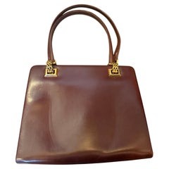 A 1960s Gucci Vintage Red Leather and Brass Hardware Evening Bag