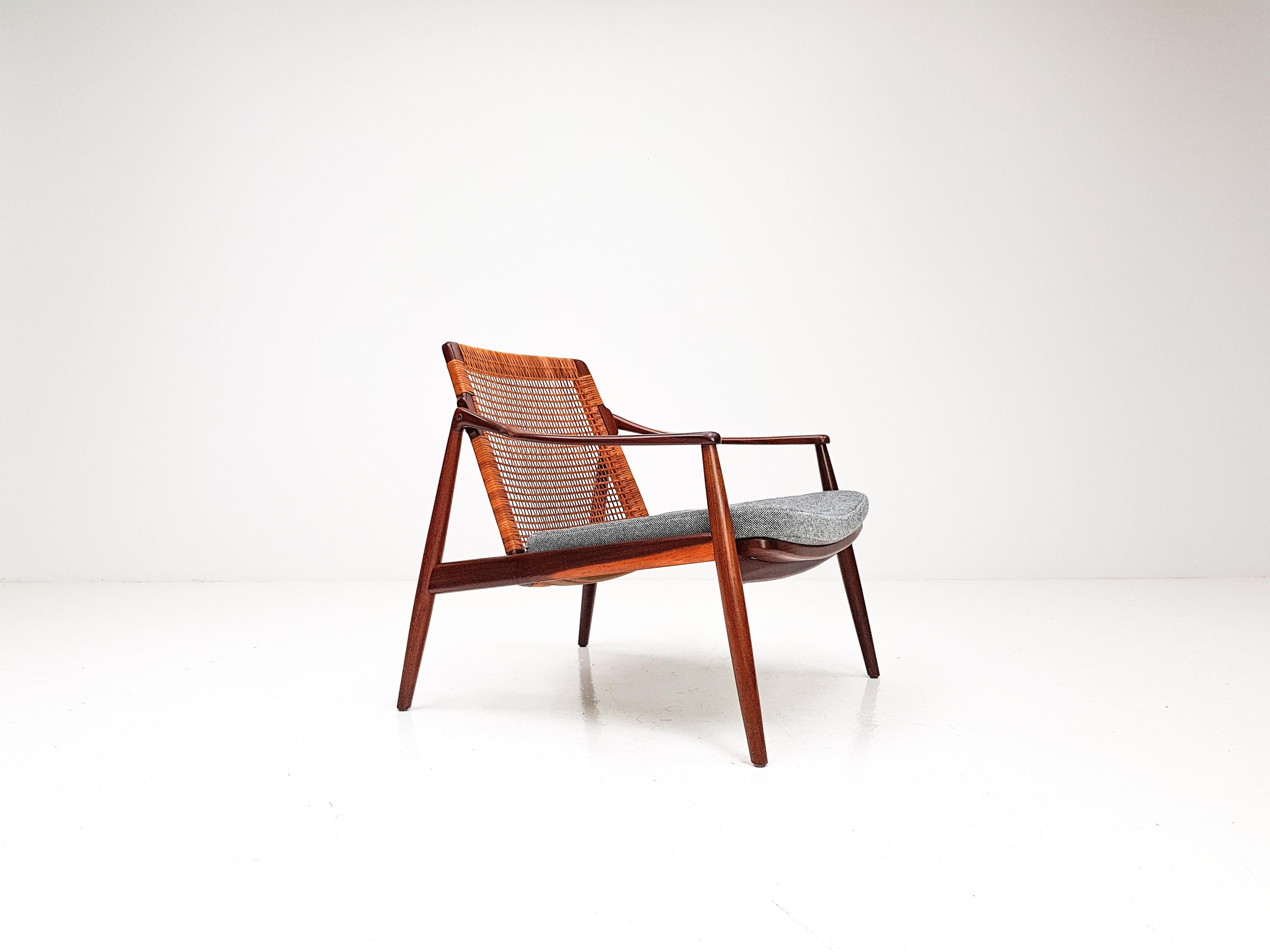 A 1960s Hartmut Lohmeyer easy chair in cane for Wilkhahn, Germany.

A beautifully shaped teak piece featuring a cane backrest. Seat pad reupholstered in Kvadrat Hallingdal 65 fabric.

Hartmut Lohmeyer was trained as an architect under Egon