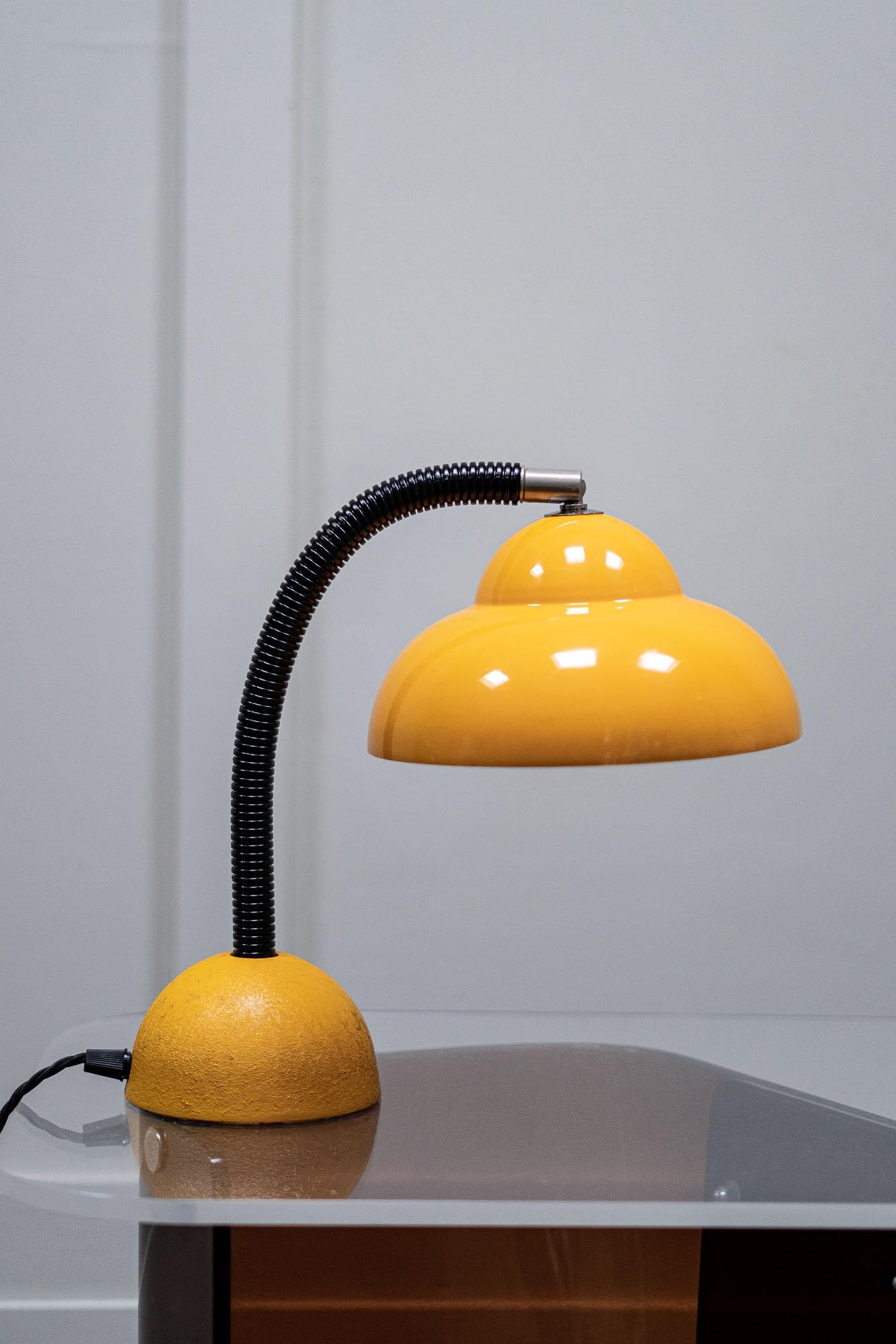 A 1960s metal gooseneck yellow desk lamp.

The shade is made of pressed aluminium with yellow paint work, the base is a cast steel, also painted yellow. 

Fully rewired and PAT Tested.

Height - 30cm
Shade Dia - 20cm
Base Dia - 12 cm
     
