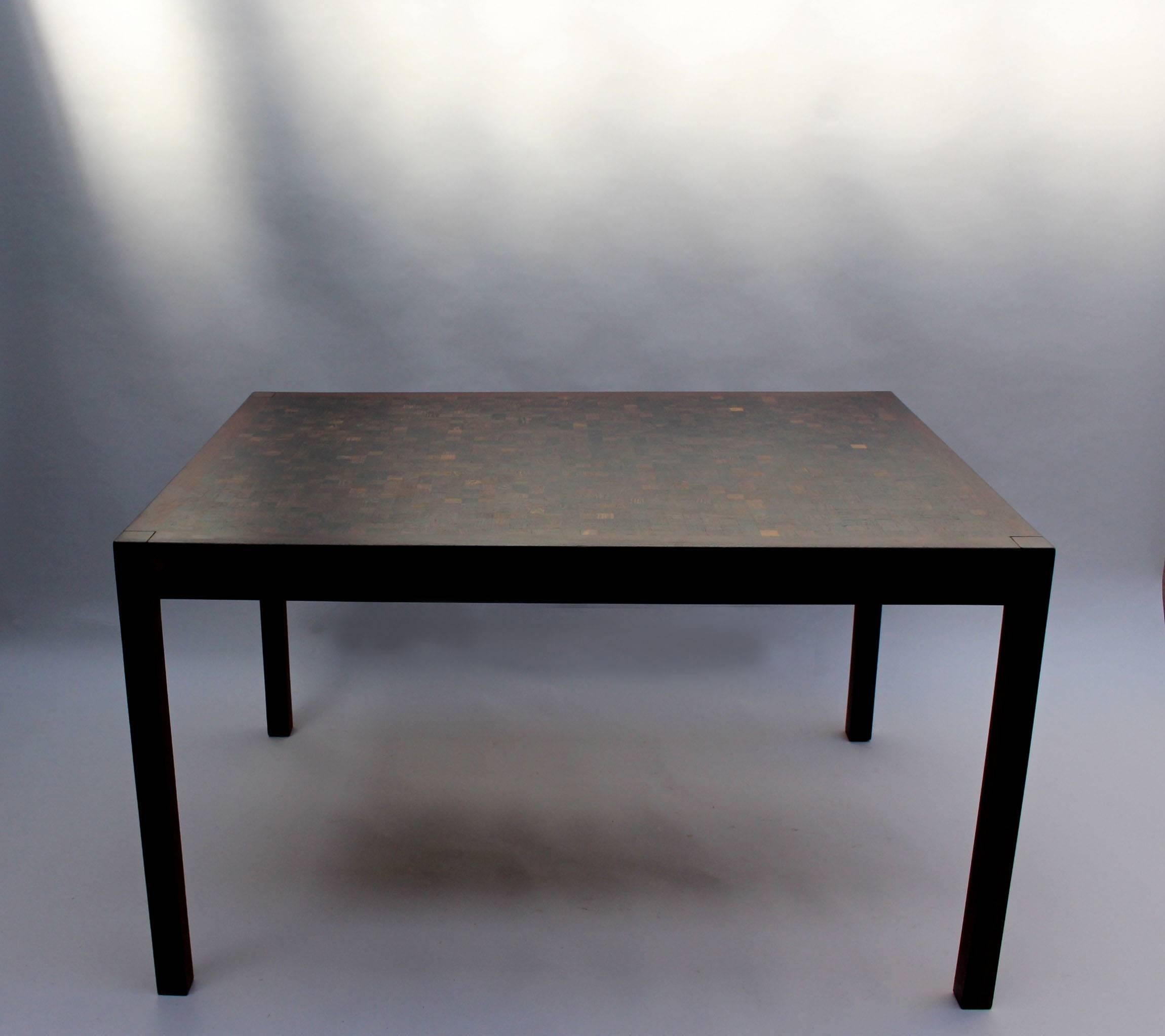 A 1960s Swiss dining table in wenge wood by Dieter Waeckerlin with inlay pattern,
two end leaves and chrome details.